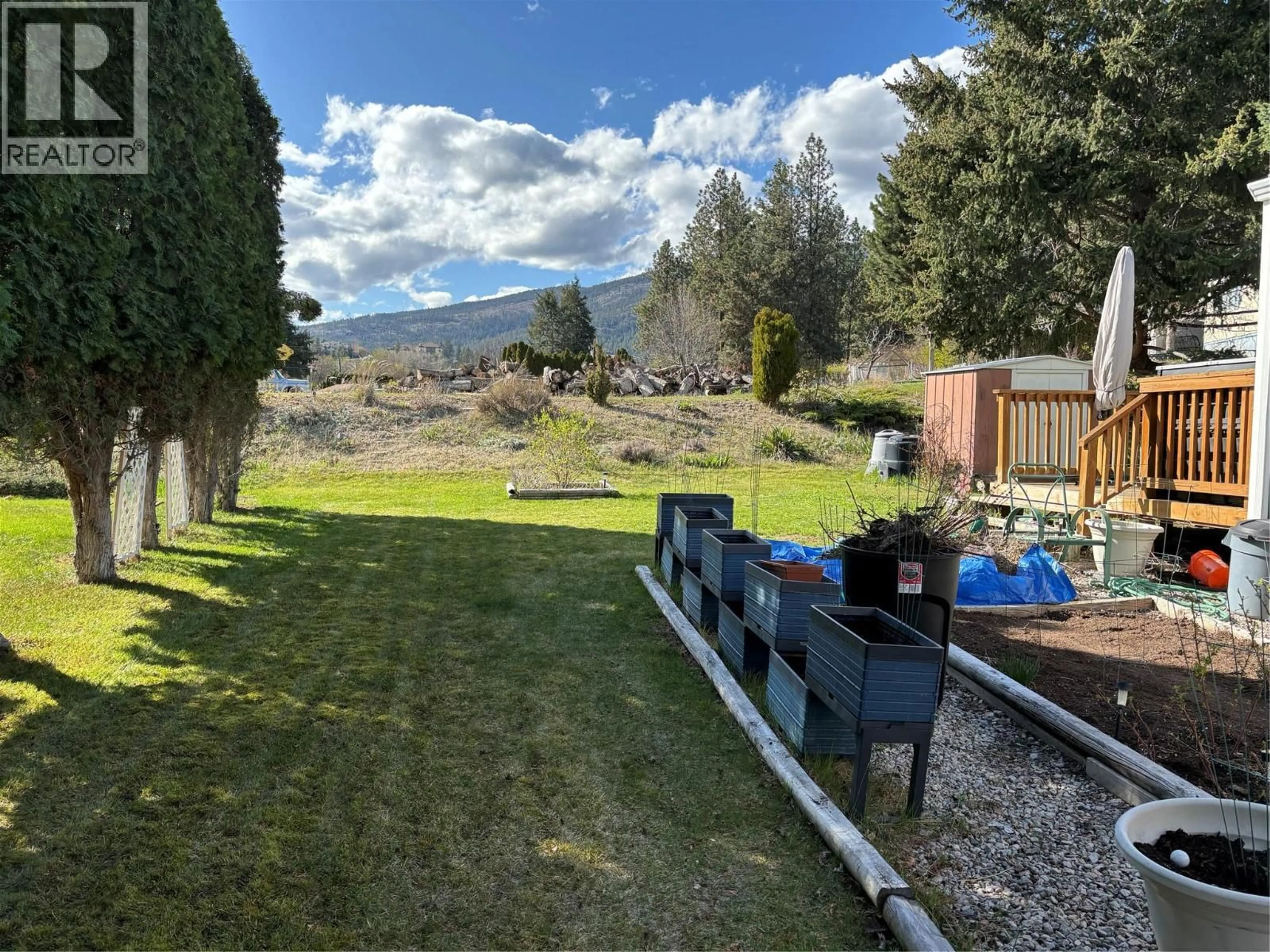 A pic from outside/outdoor area/front of a property/back of a property/a pic from drone, mountain view for 64 - 1929 97 HIGHWAY SOUTH, West Kelowna British Columbia V1Z2Z1