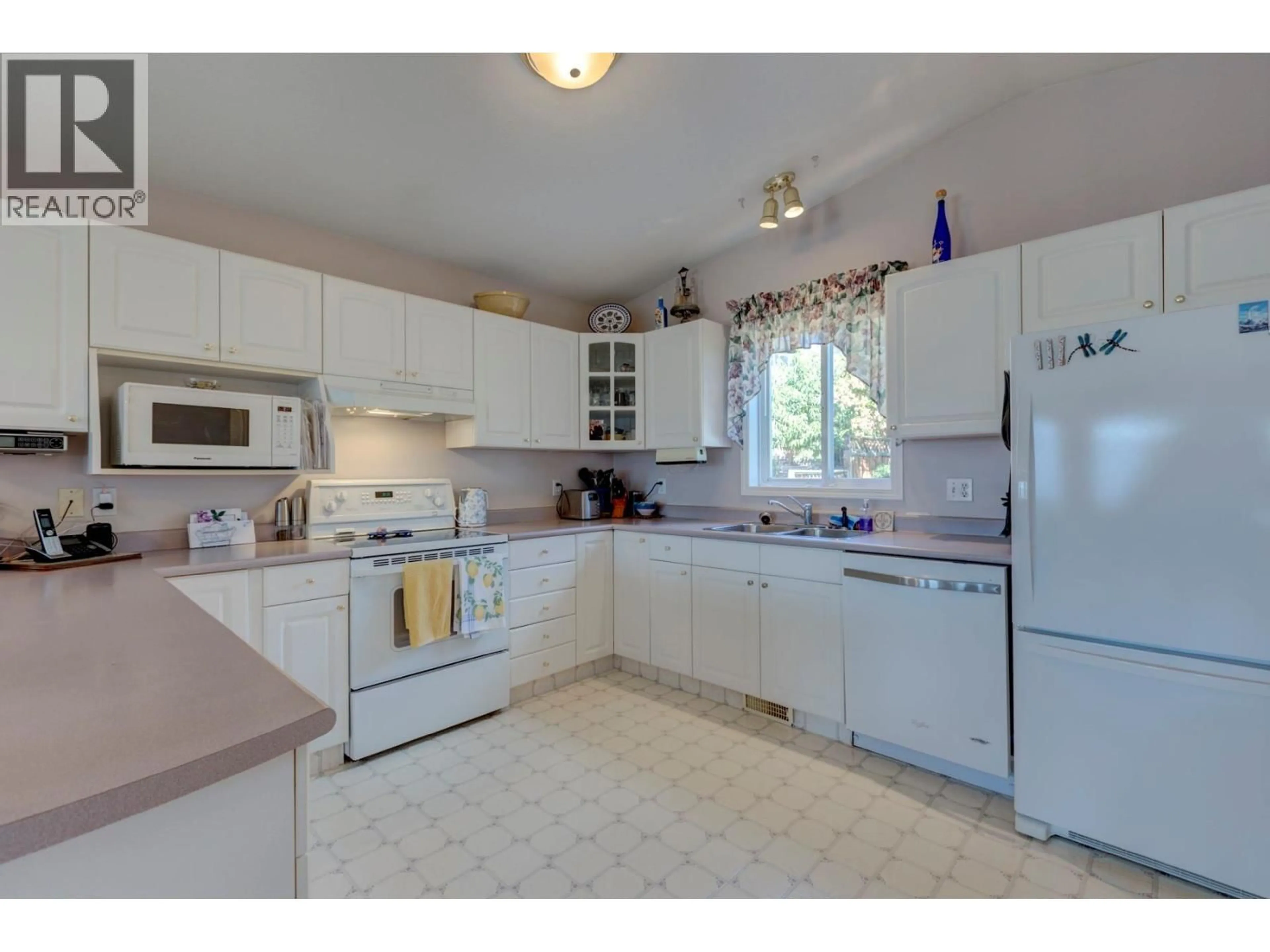 Standard kitchen, ceramic/tile floor for 324 VILLAGE LANE, West Kelowna British Columbia V4T1X6