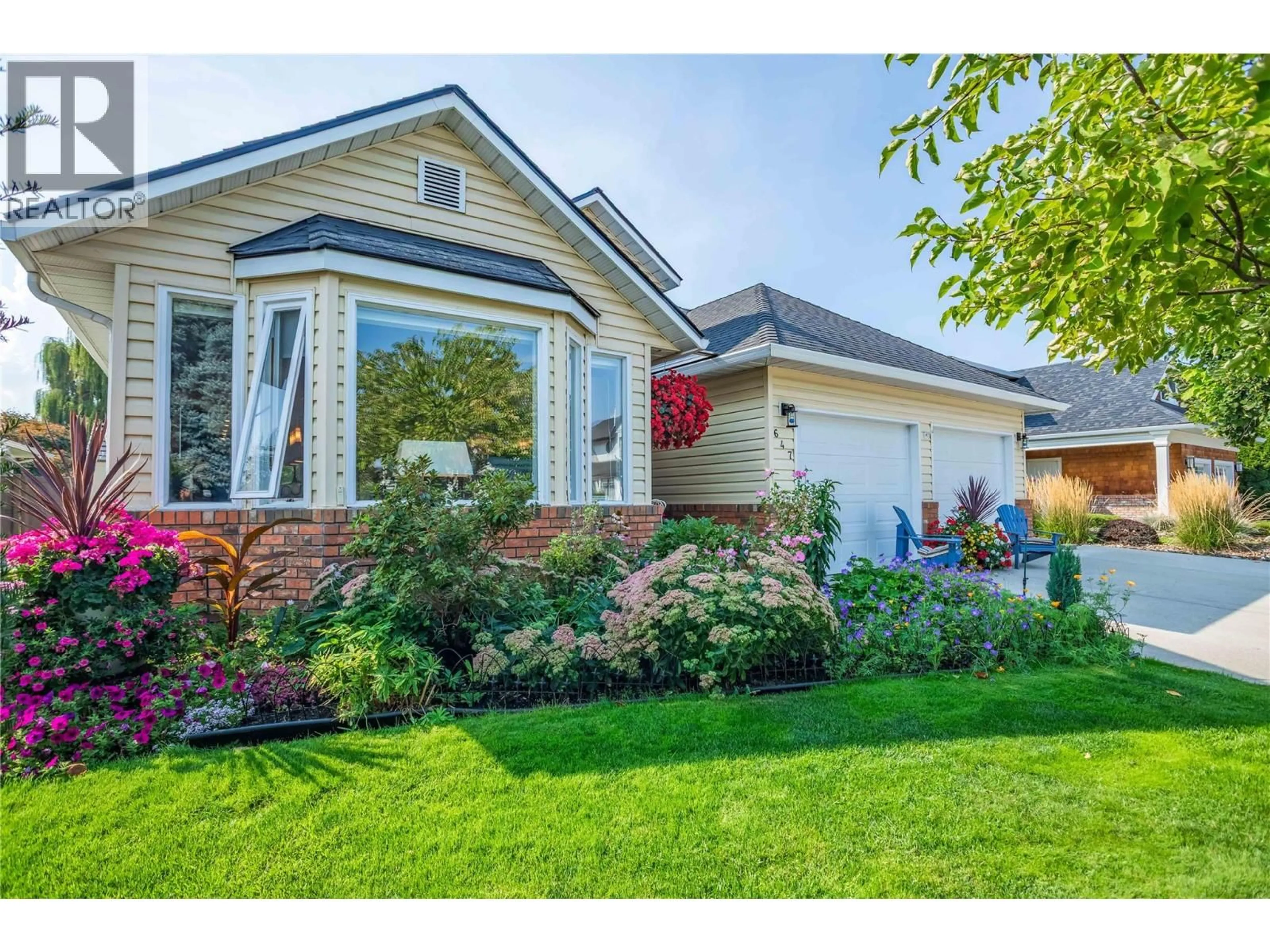 Home with vinyl exterior material, street for 647 PIMLICO ROAD, Kelowna British Columbia V1W2Z2