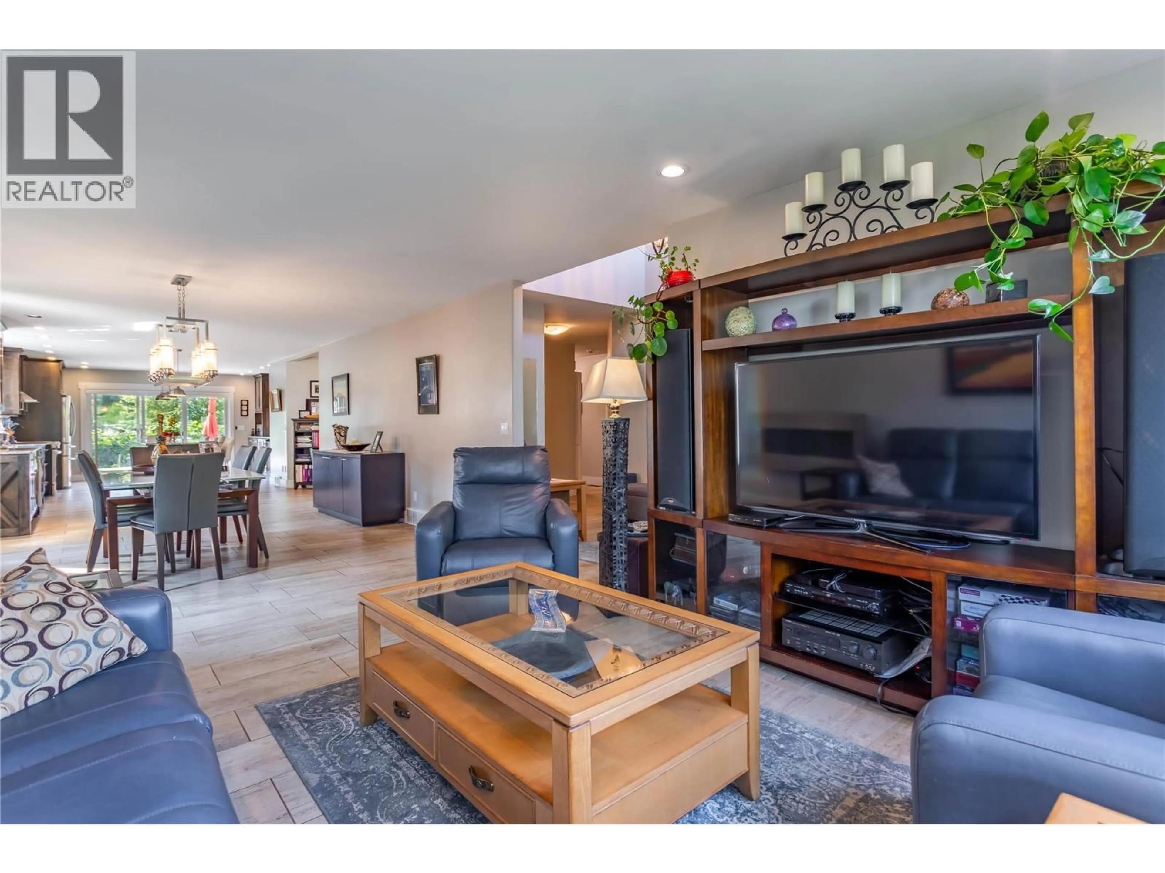 Living room with furniture, wood/laminate floor for 647 PIMLICO ROAD, Kelowna British Columbia V1W2Z2