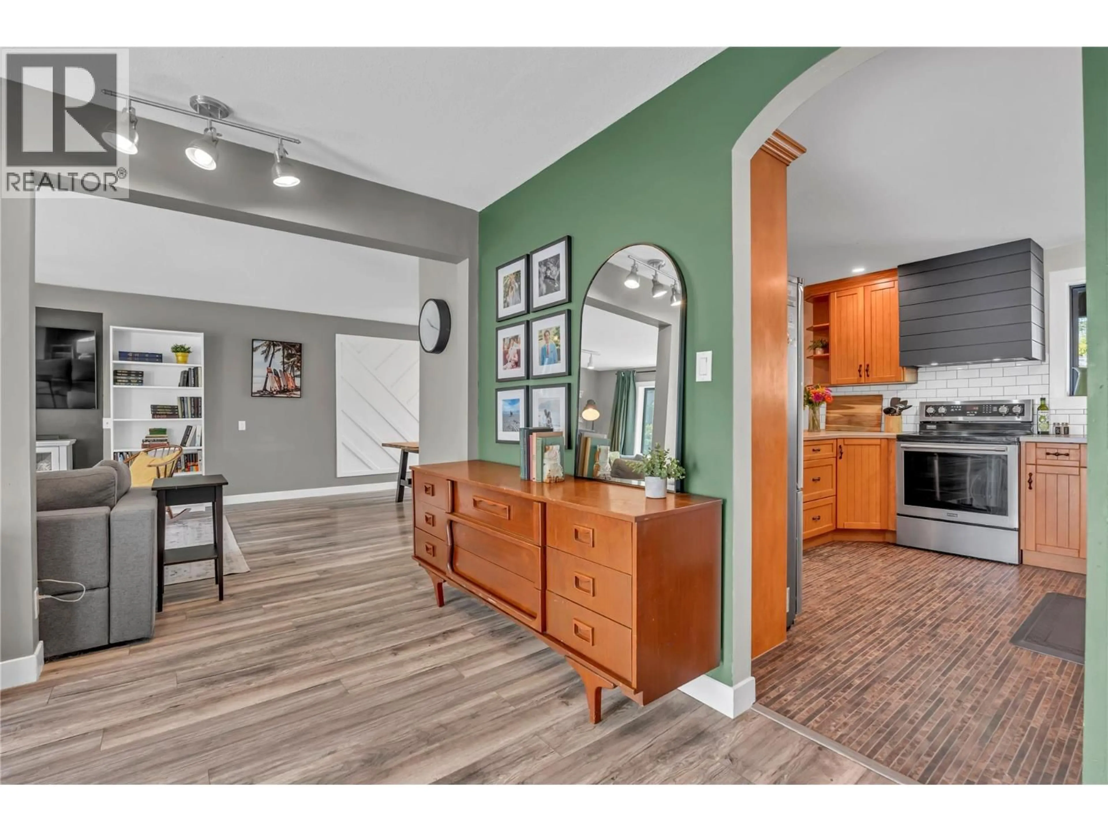 Open concept kitchen, wood/laminate floor for 10816 VICTORIA ROAD SOUTH, Summerland British Columbia V0H1Z0