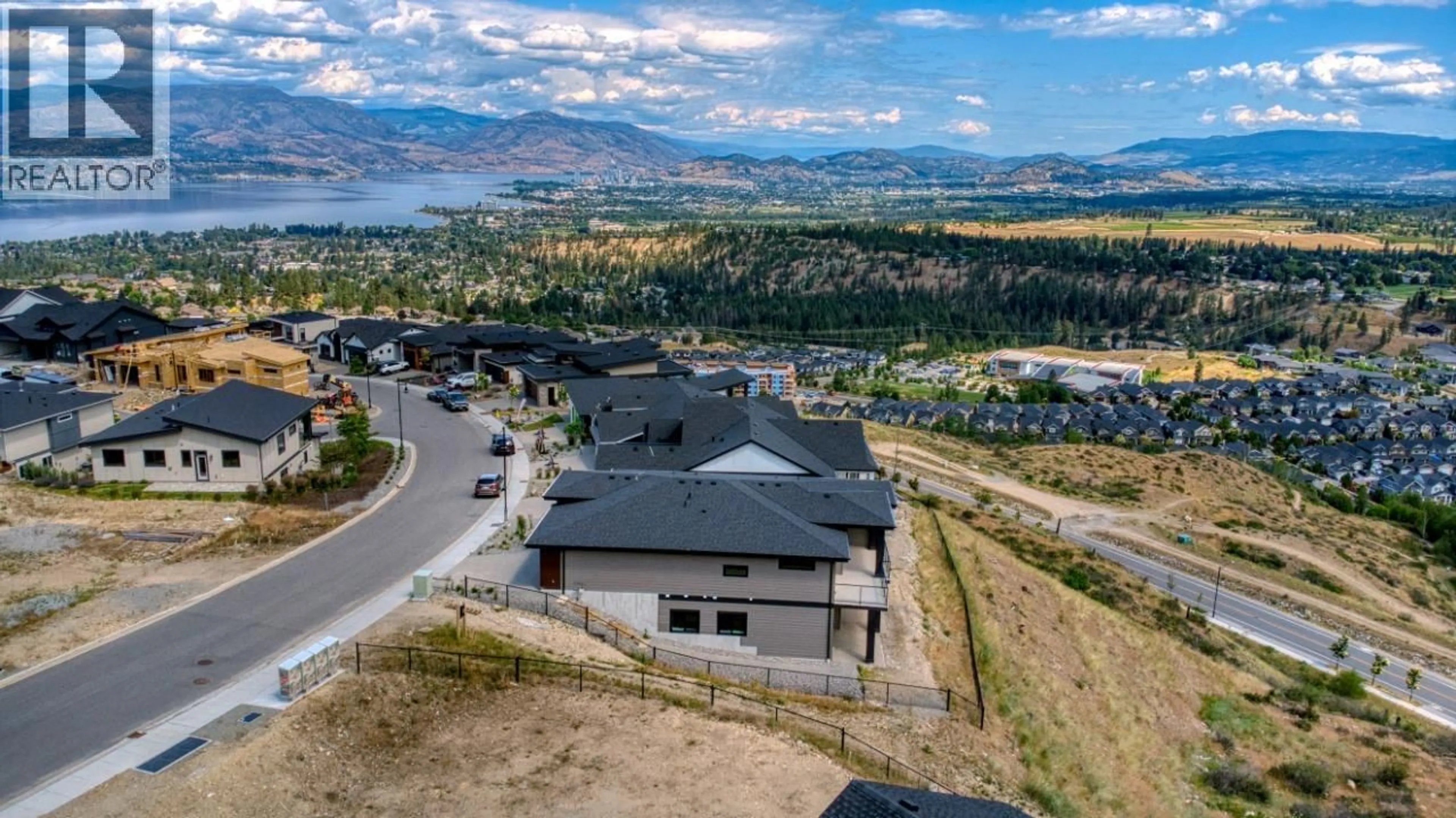 A pic from outside/outdoor area/front of a property/back of a property/a pic from drone, mountain view for 1070 EMSLIE STREET, Kelowna British Columbia V1W0C3