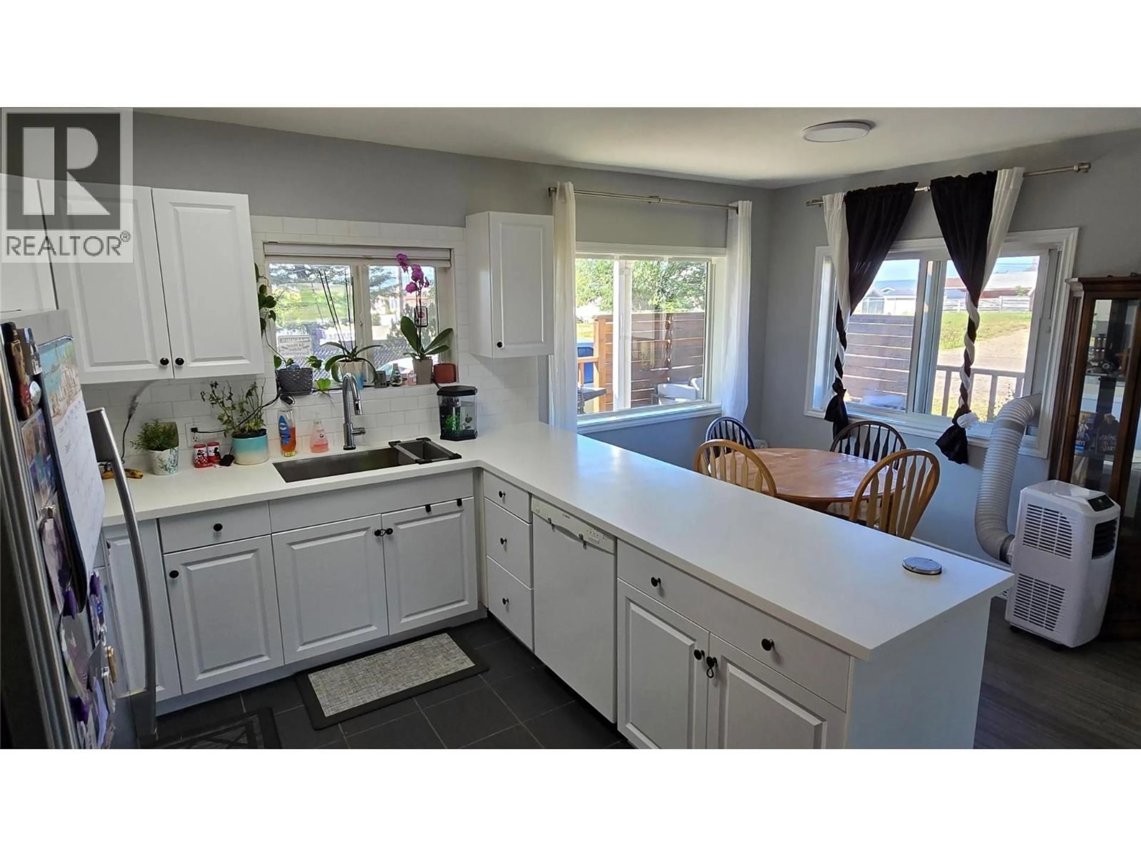Open concept kitchen, ceramic/tile floor for 345 99 AVENUE, Dawson Creek British Columbia V1G1T1
