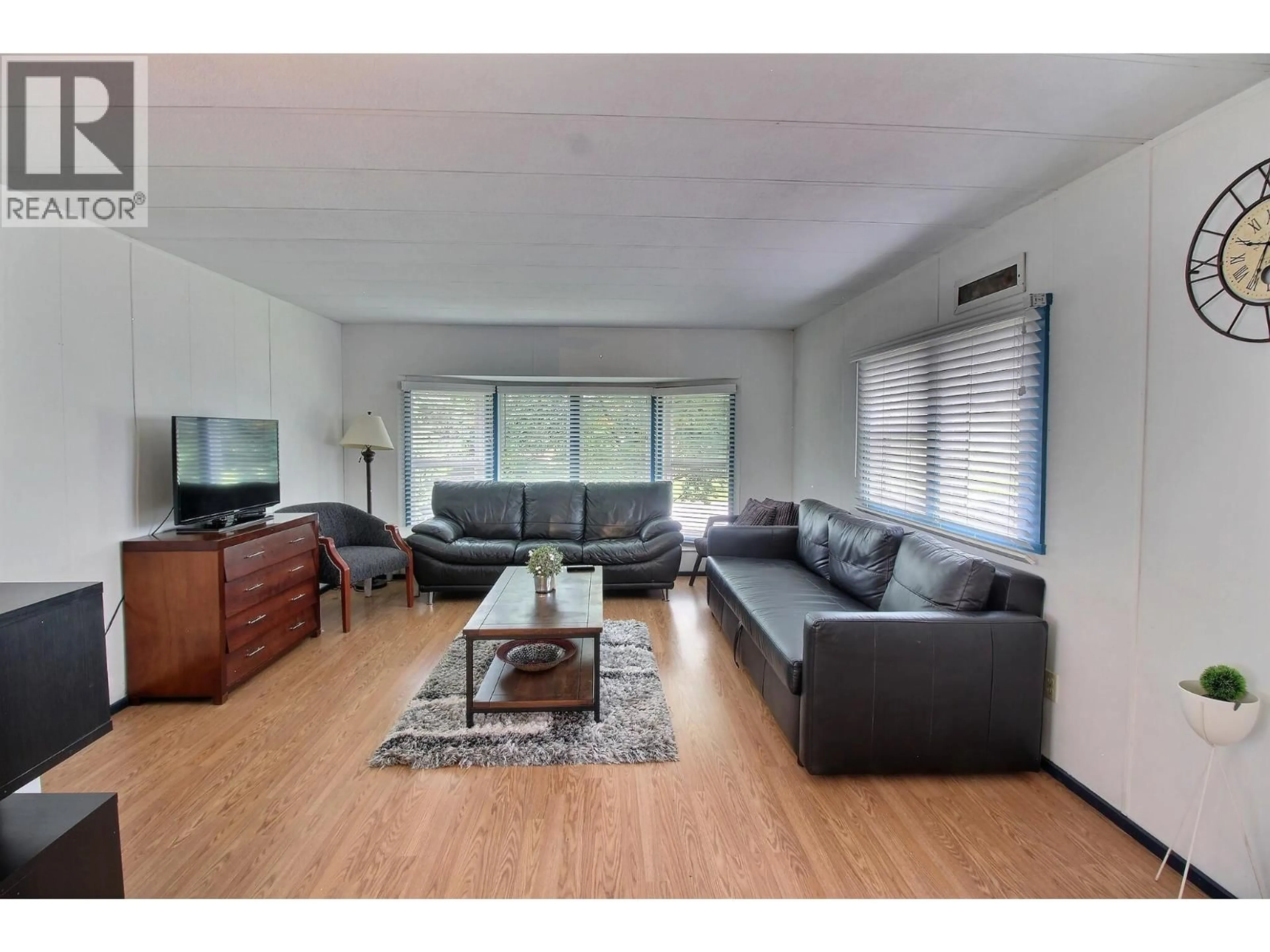 Living room with furniture, wood/laminate floor for 1040 9 AVENUE NORTH, Golden British Columbia V0A1H2