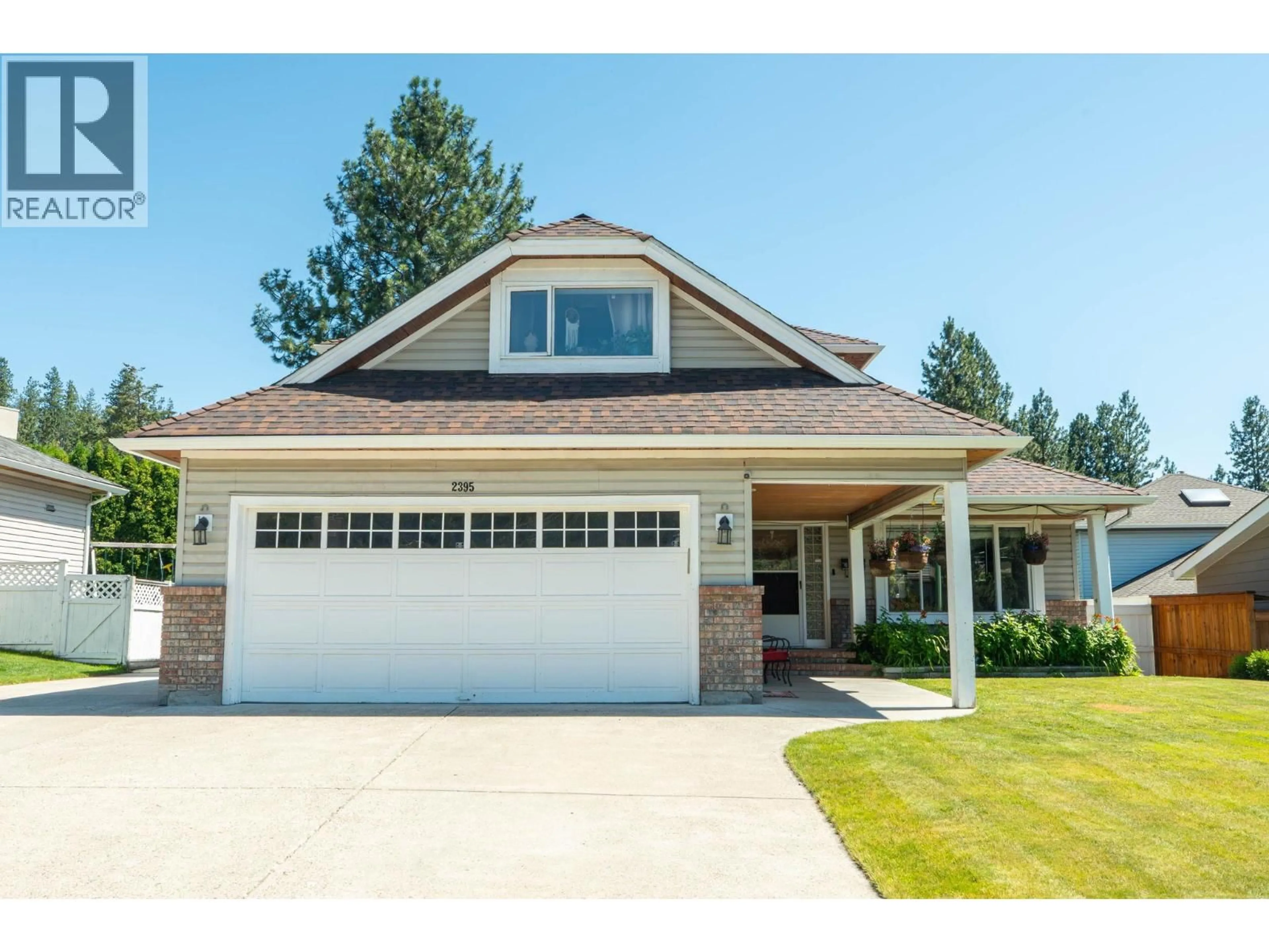 Home with vinyl exterior material, street for 2395 SHANNON RIDGE DRIVE, West Kelowna British Columbia V4T1T1