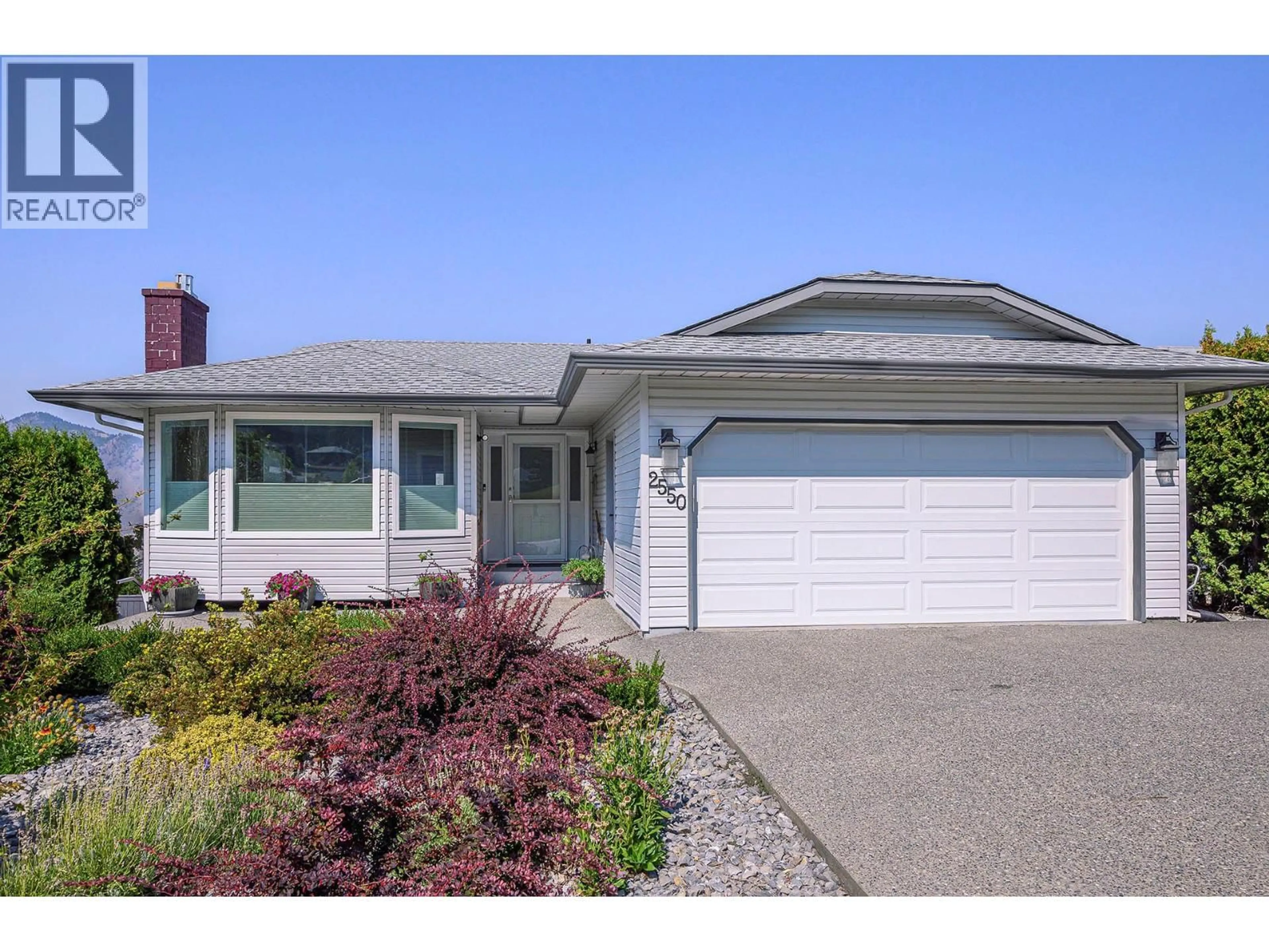 Home with vinyl exterior material, street for 2550 NECHAKO DRIVE, Kamloops British Columbia V2E2C9