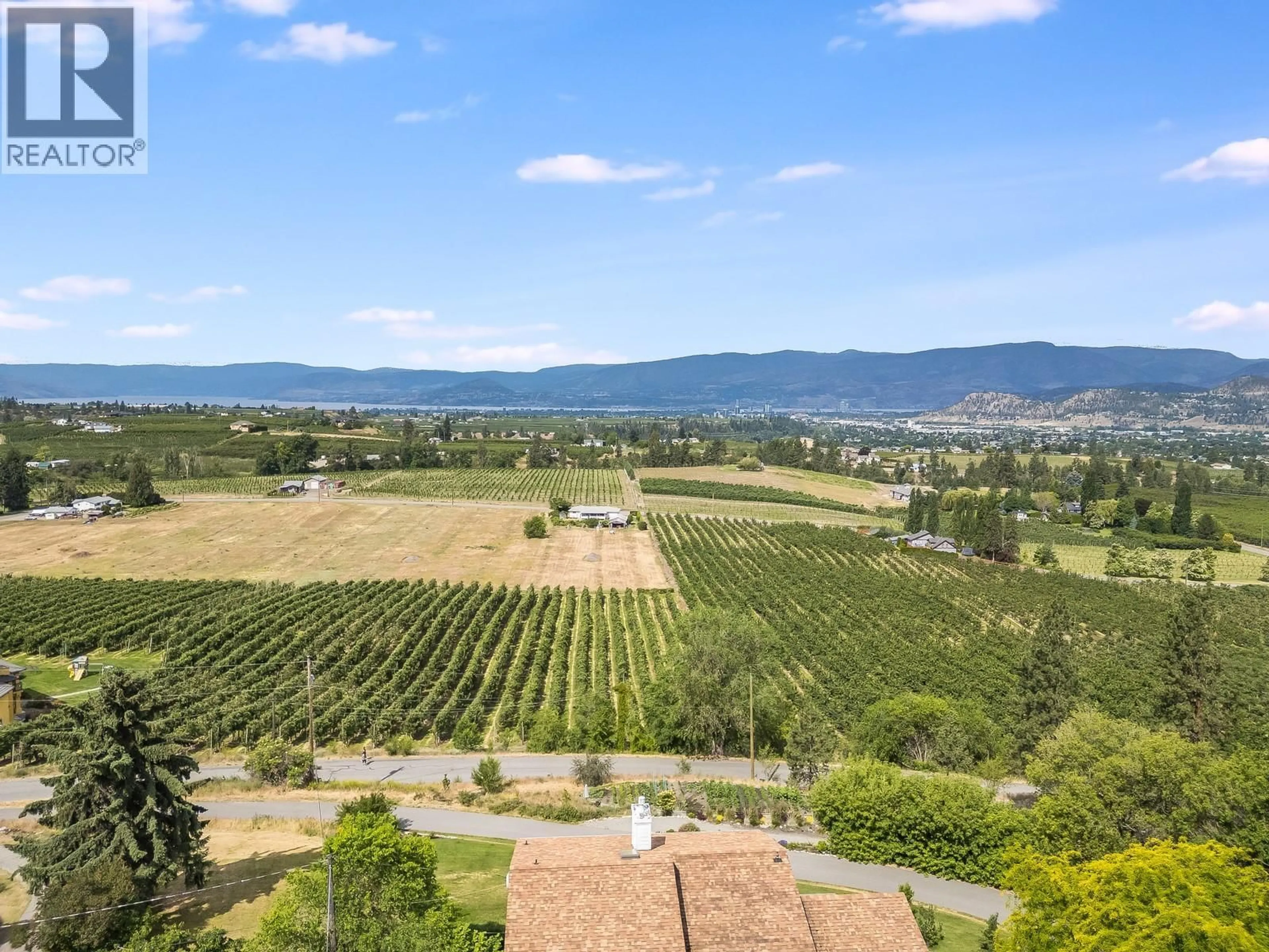 A pic from outside/outdoor area/front of a property/back of a property/a pic from drone, mountain view for 1293 HIGHWAY 33 OTHER EAST, Kelowna British Columbia V1P1M1