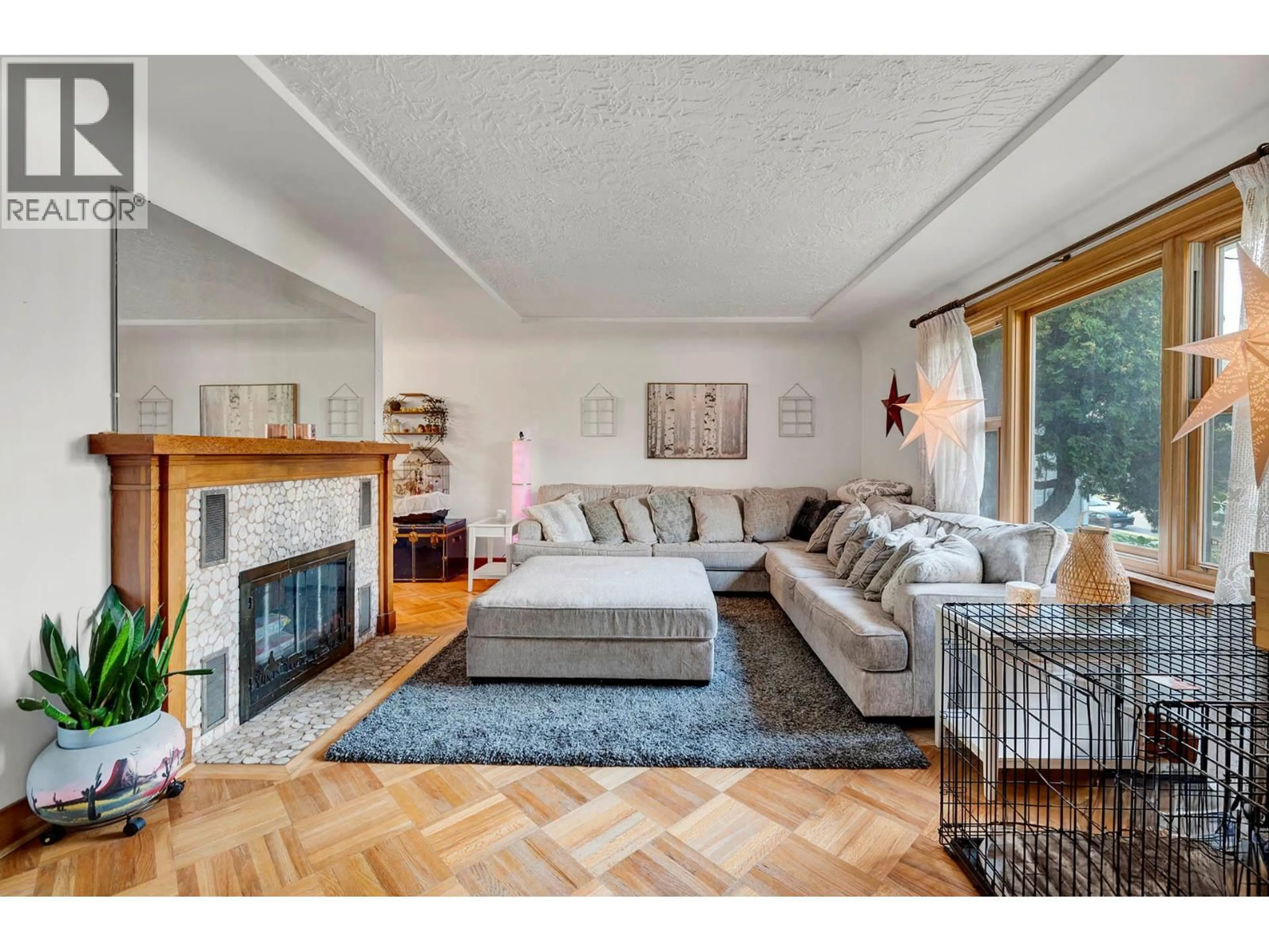 Living room with furniture, wood/laminate floor for 665 COLUMBIA STREET, Kamloops British Columbia V2C2V2