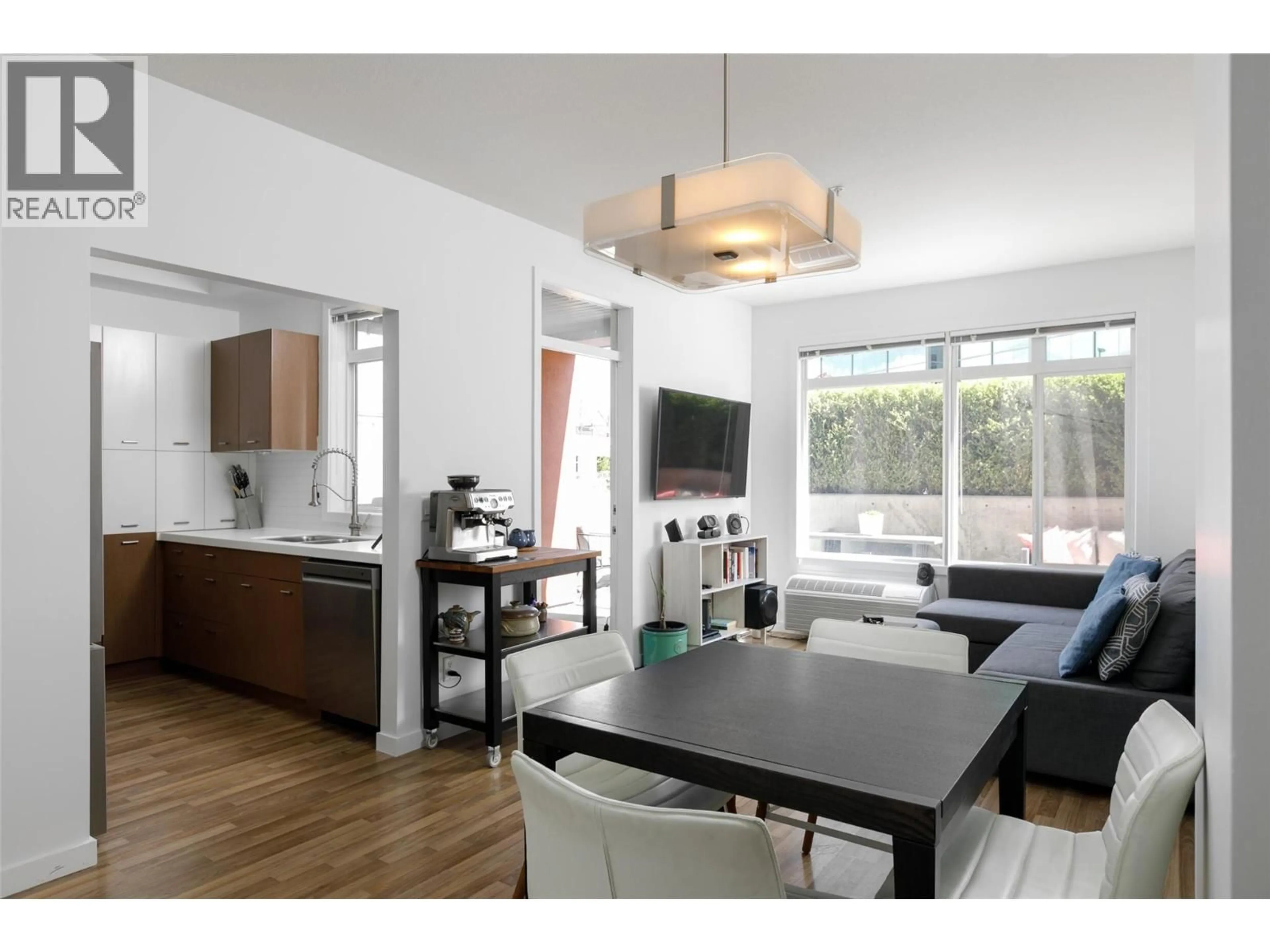 Open concept kitchen, wood/laminate floor for 110 - 1550 DICKSON AVENUE, Kelowna British Columbia V1Y9Y8