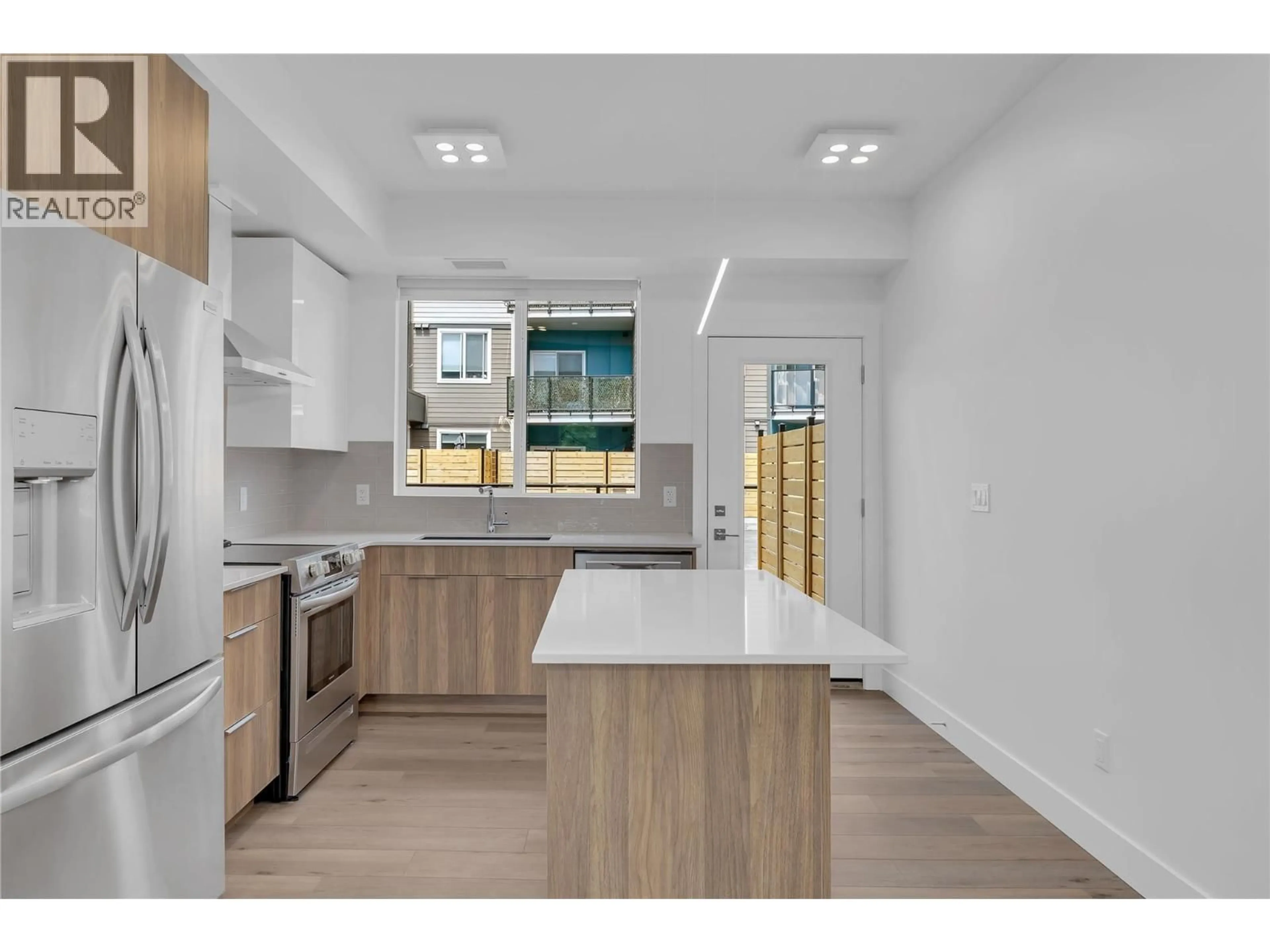 Open concept kitchen, ceramic/tile floor for 102C - 3642 MISSION SPRINGS DRIVE, Kelowna British Columbia V1W0E1