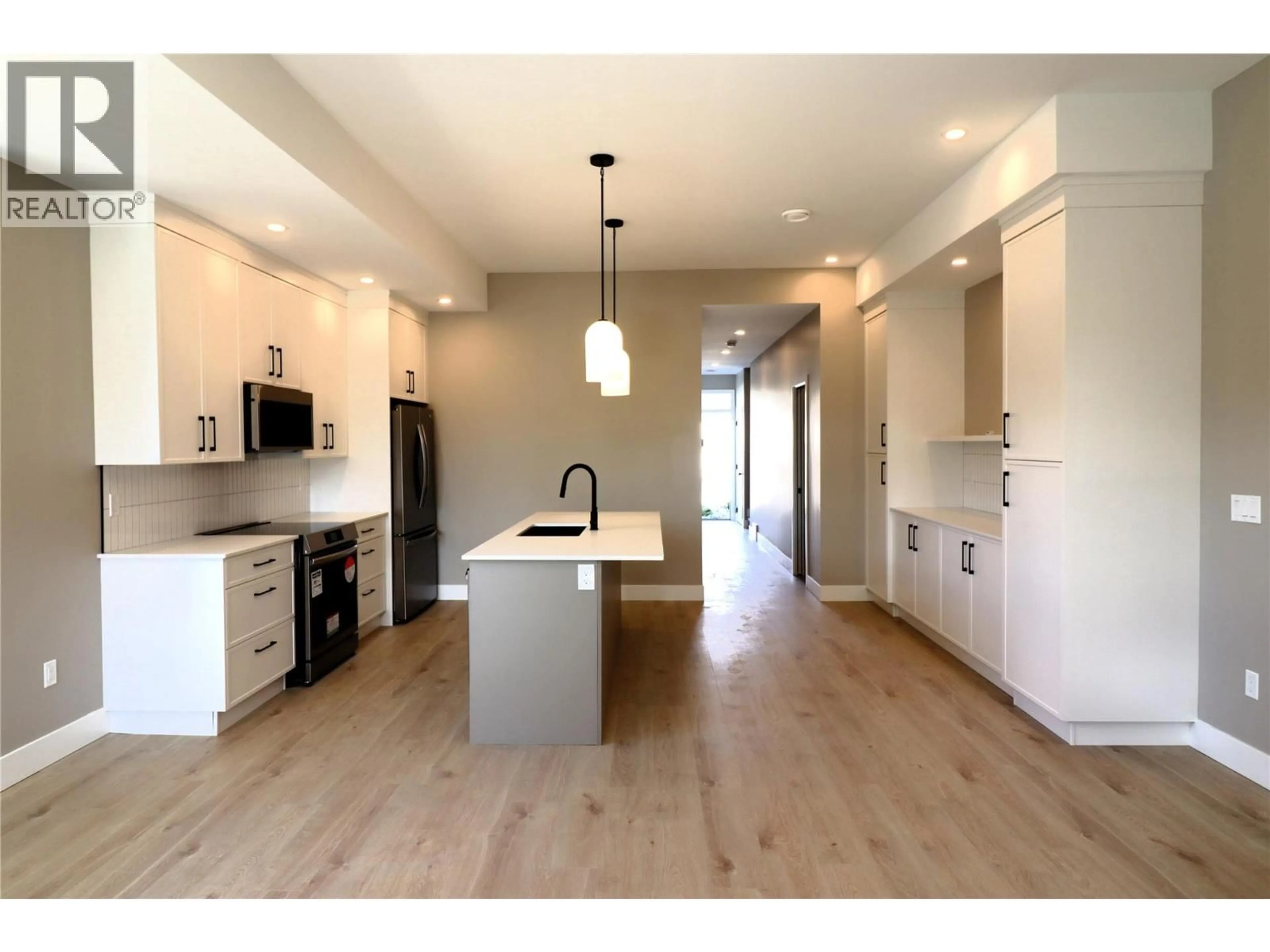 Open concept kitchen, wood/laminate floor for 161 CHESTNUT AVENUE, Kamloops British Columbia V2B1L3
