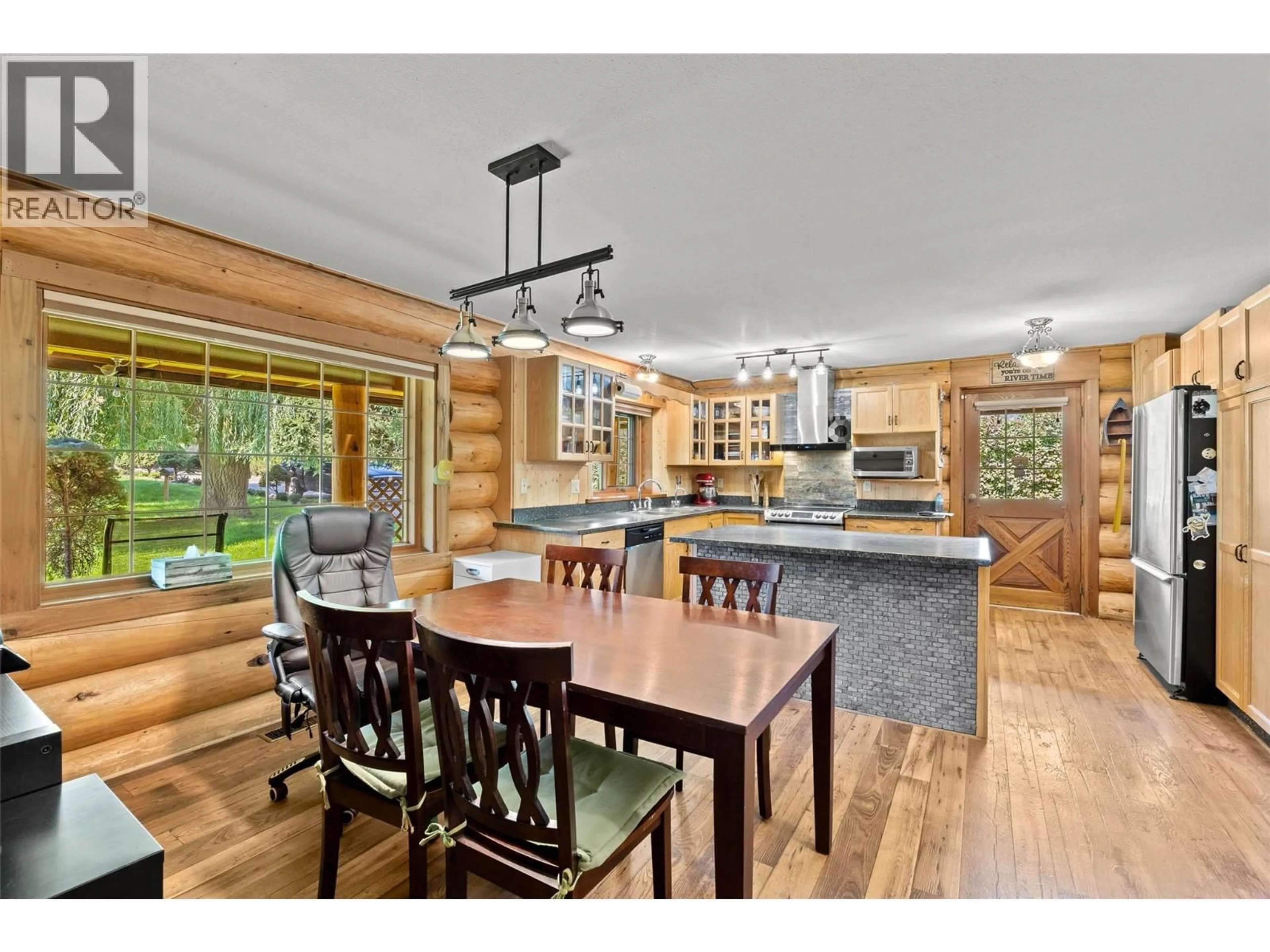 Open concept kitchen, wood/laminate floor for 311 HOLLYWOOD CRESCENT, Lillooet British Columbia V0K1V0