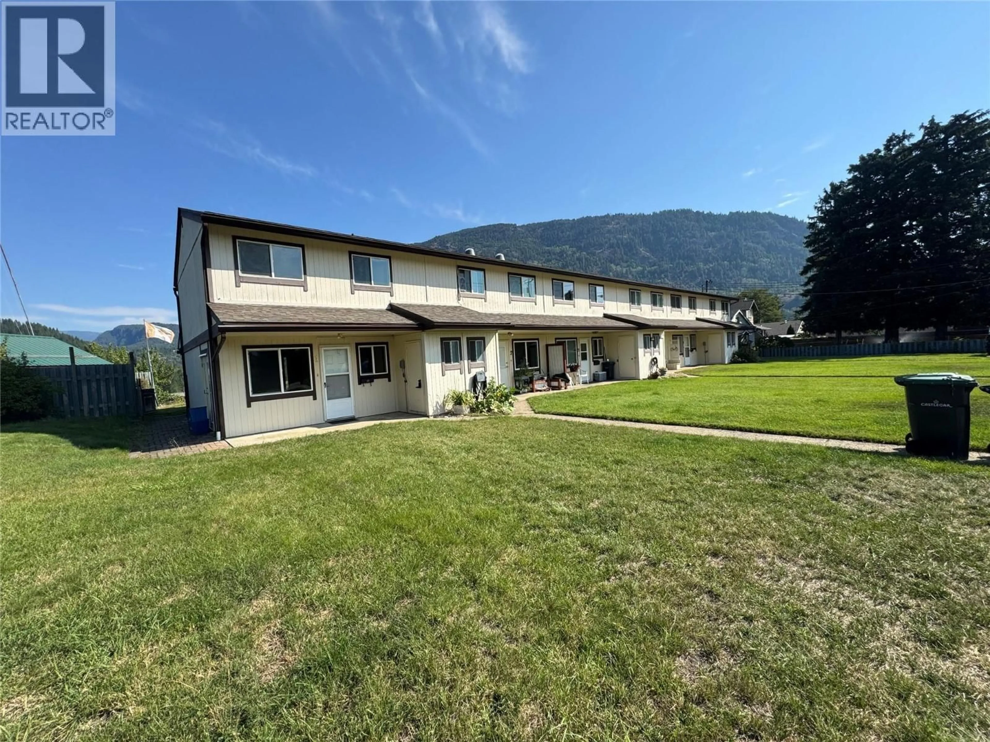 A pic from outside/outdoor area/front of a property/back of a property/a pic from drone, mountain view for 1 - 1225 1ST STREET, Castlegar British Columbia V1N1A1