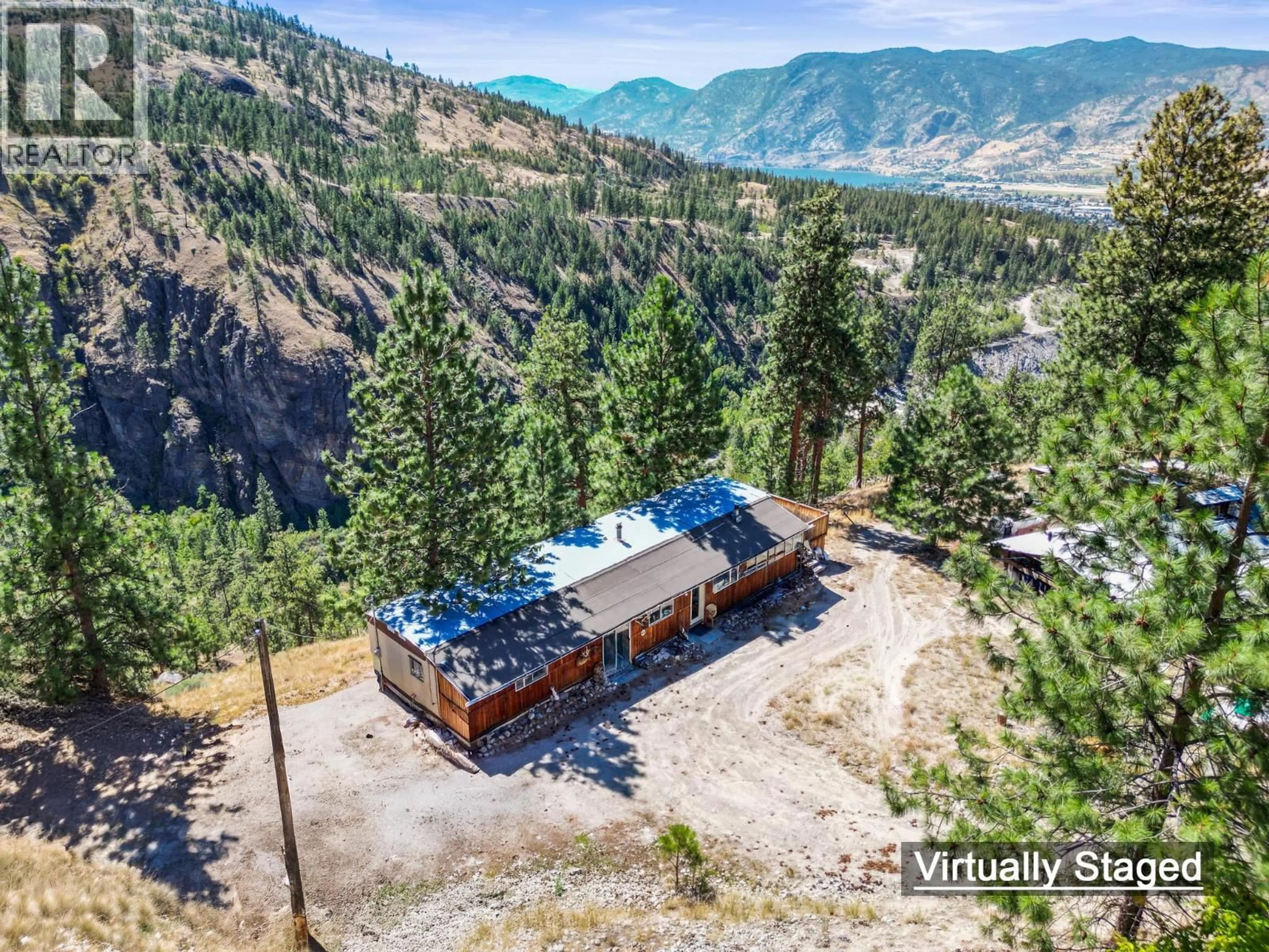 A pic from outside/outdoor area/front of a property/back of a property/a pic from drone, mountain view for 158 SALIKEN DRIVE, Penticton British Columbia V2A8V6