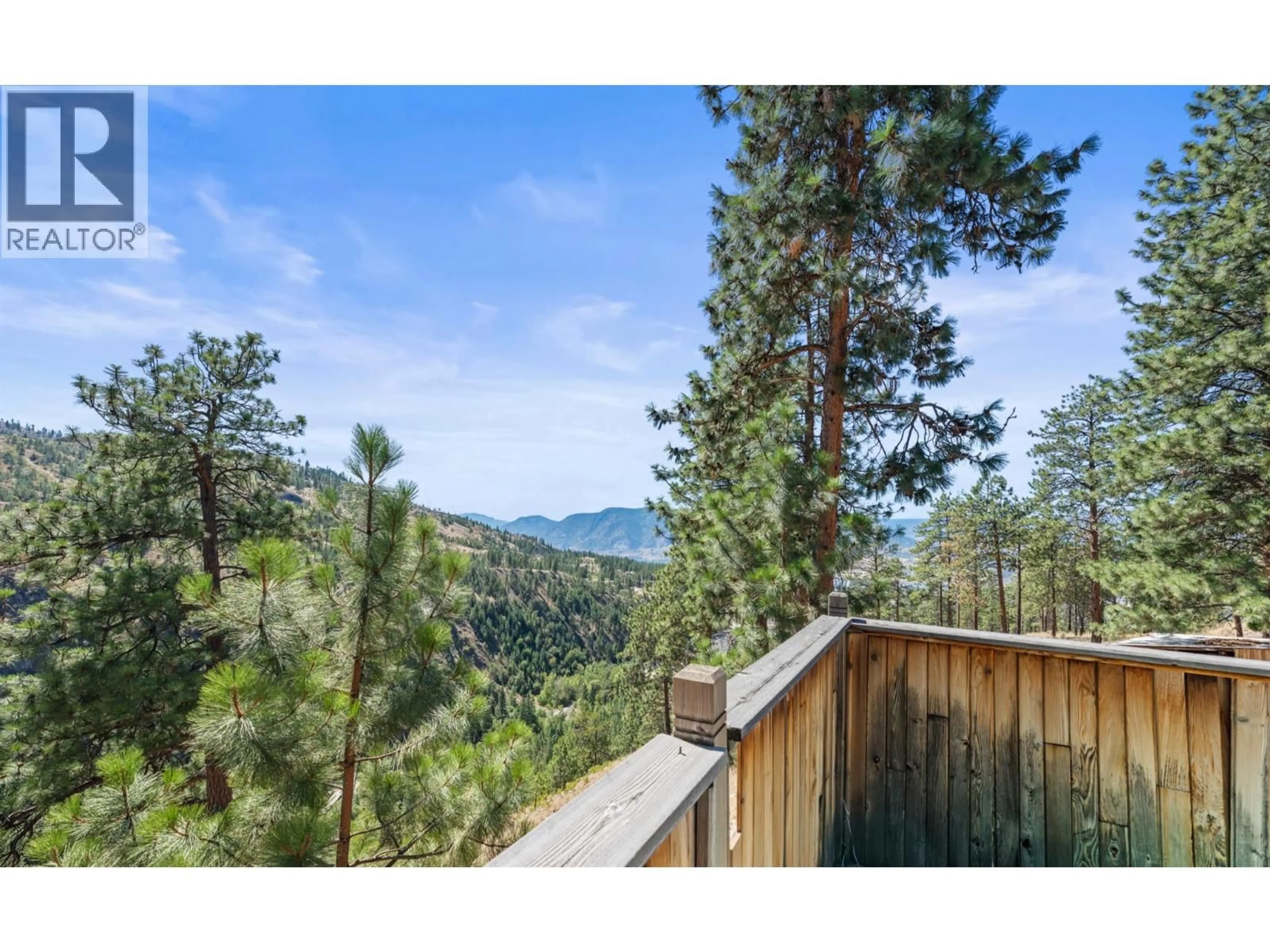 A pic from outside/outdoor area/front of a property/back of a property/a pic from drone, forest/trees view for 158 SALIKEN DRIVE, Penticton British Columbia V2A8V6