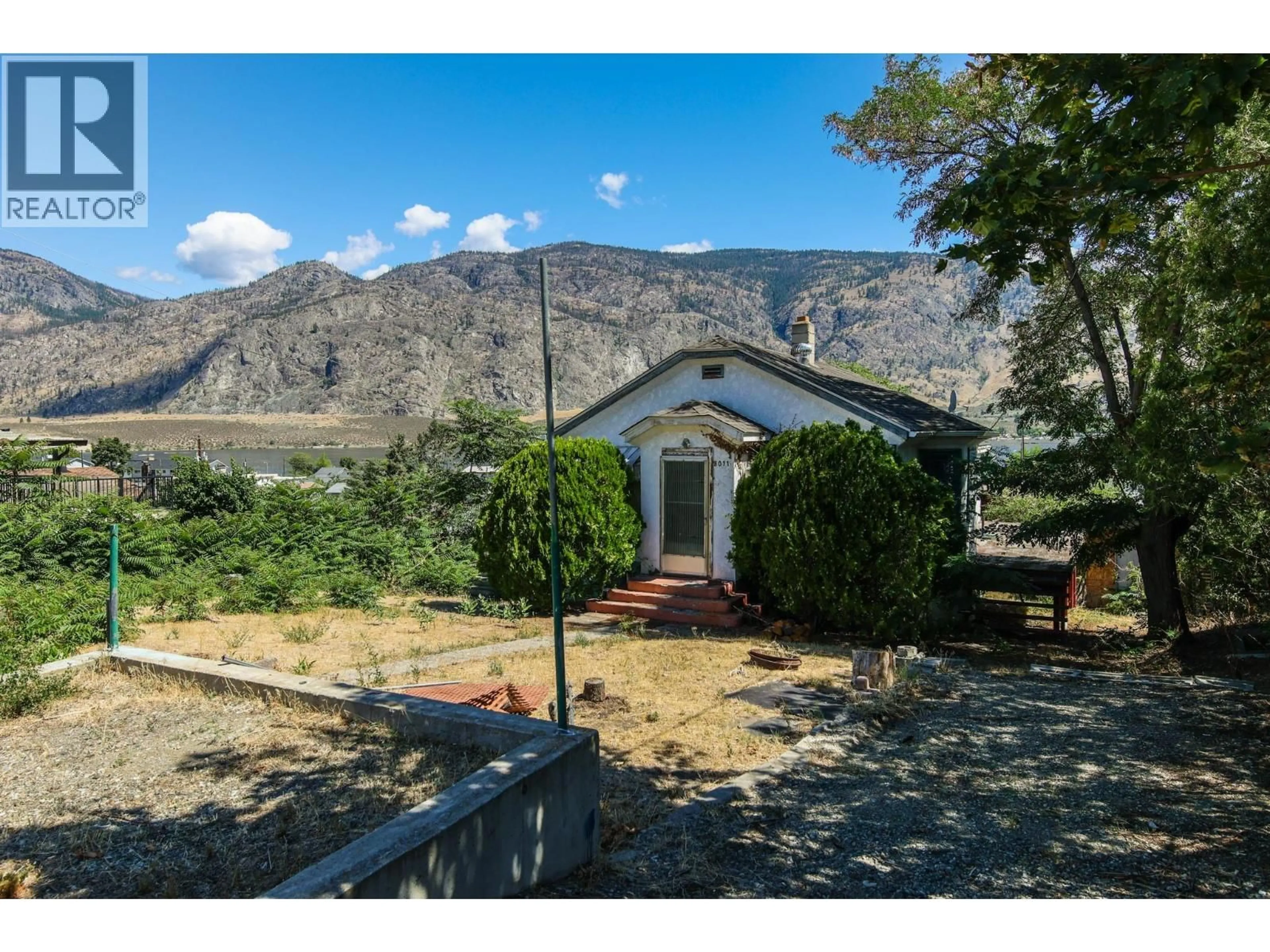 A pic from outside/outdoor area/front of a property/back of a property/a pic from drone, mountain view for 8011 87TH STREET, Osoyoos British Columbia V0H1V0