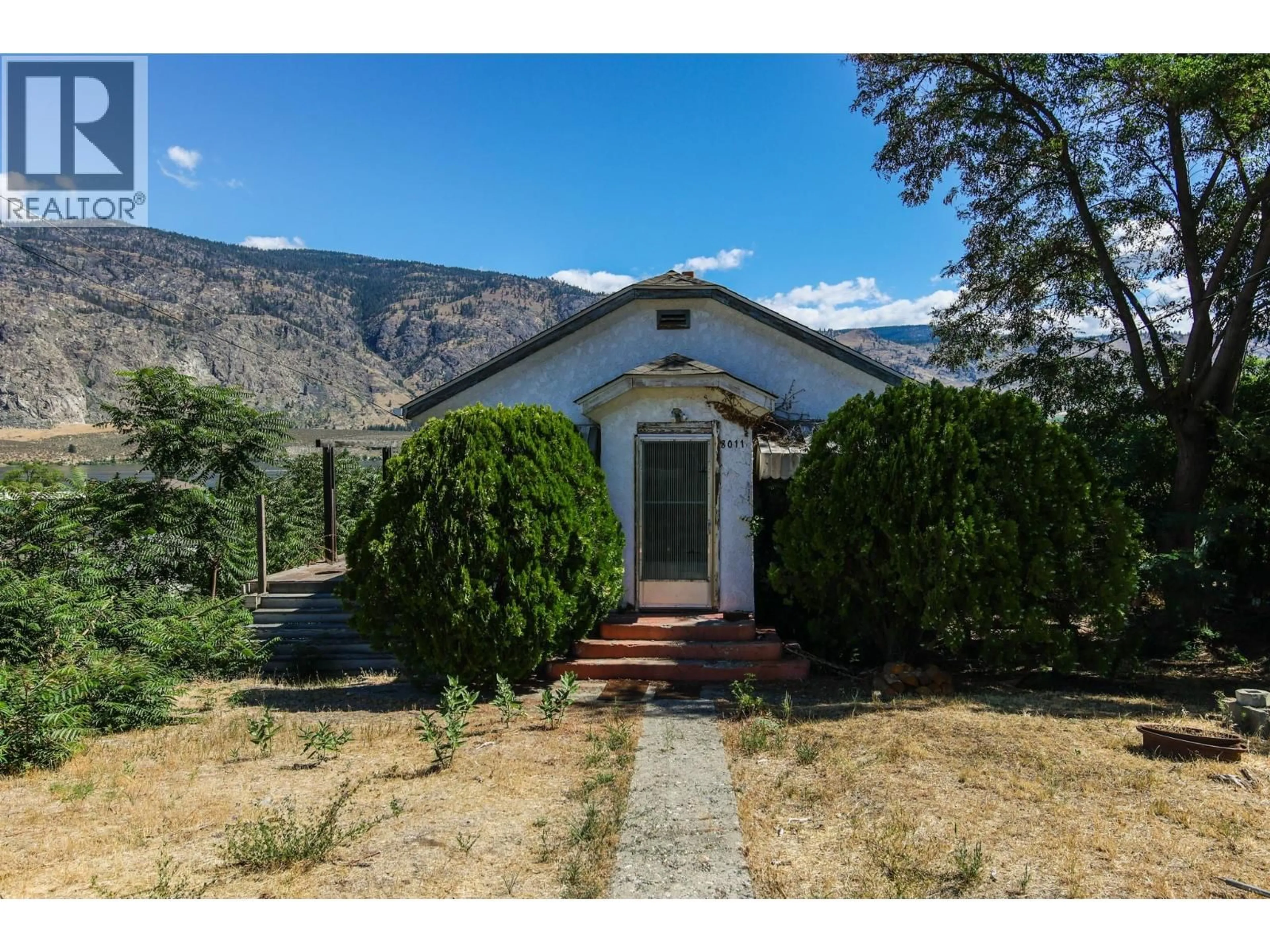A pic from outside/outdoor area/front of a property/back of a property/a pic from drone, mountain view for 8011 87TH STREET, Osoyoos British Columbia V0H1V0