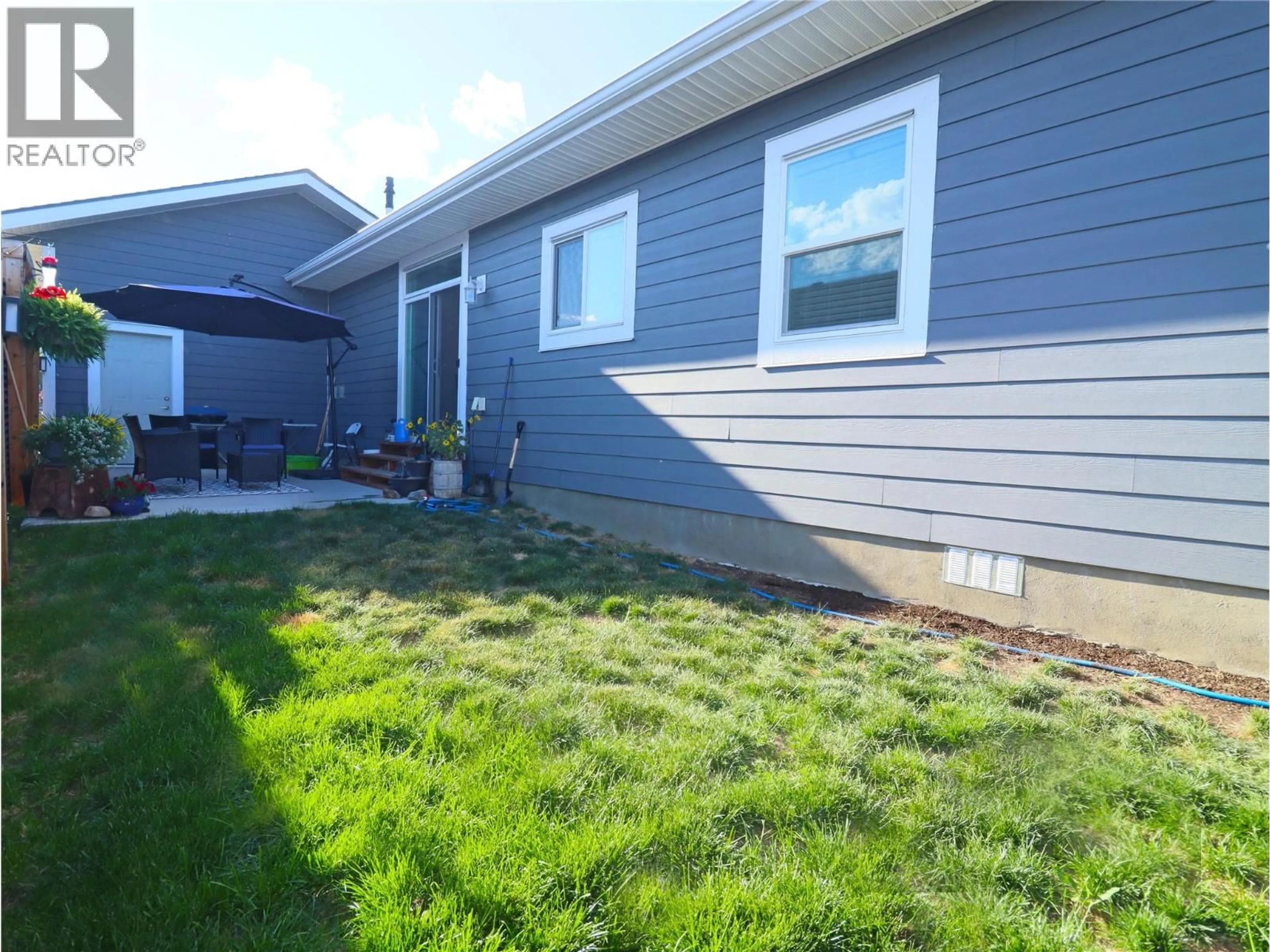 Home with vinyl exterior material, street for 7654 18TH STREET, Grand Forks British Columbia V0H1H2