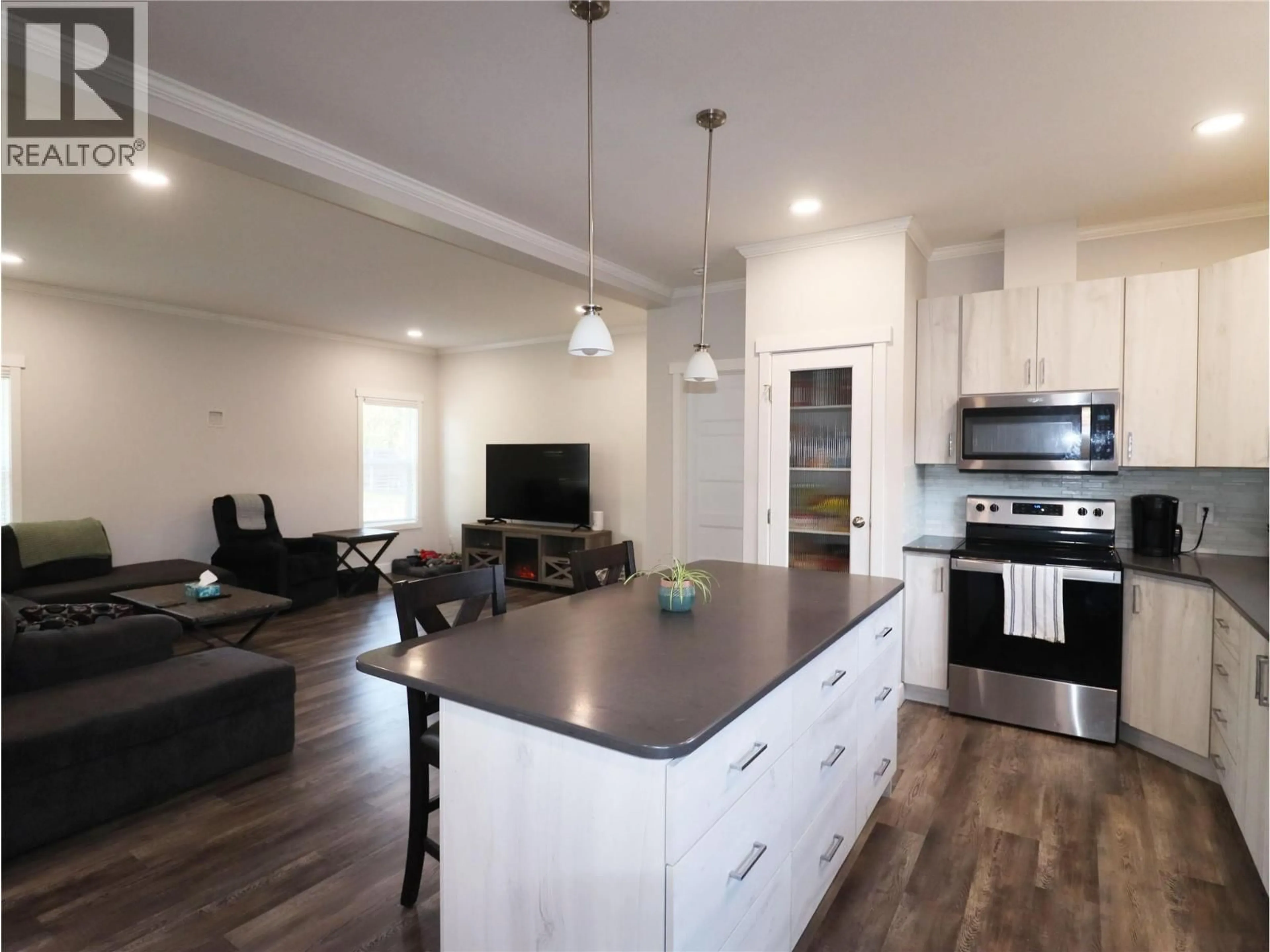 Open concept kitchen, wood/laminate floor for 7654 18TH STREET, Grand Forks British Columbia V0H1H2