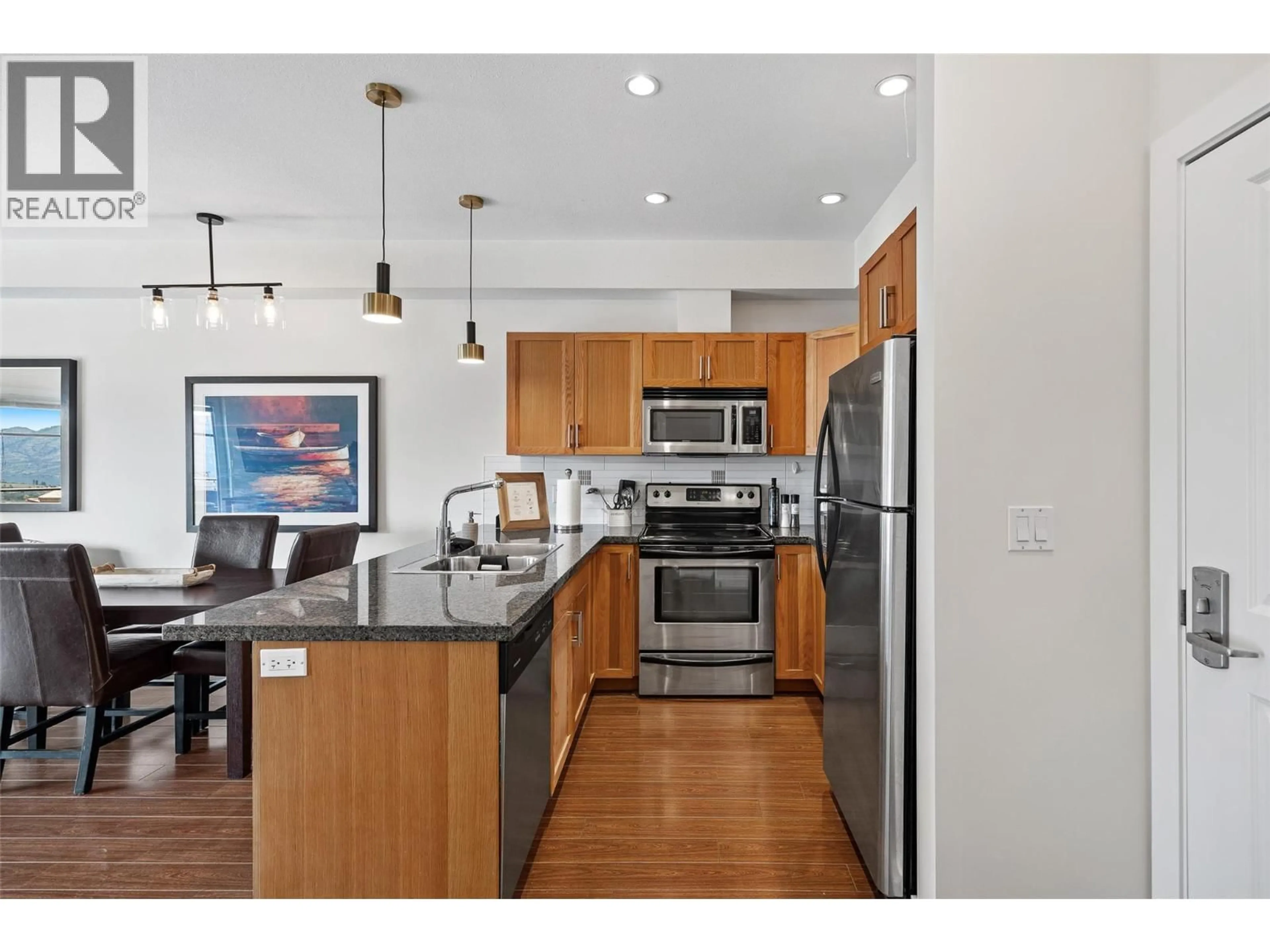 Open concept kitchen, wood/laminate floor for 411 - 3211 SKYVIEW LANE, West Kelowna British Columbia V4T1S4