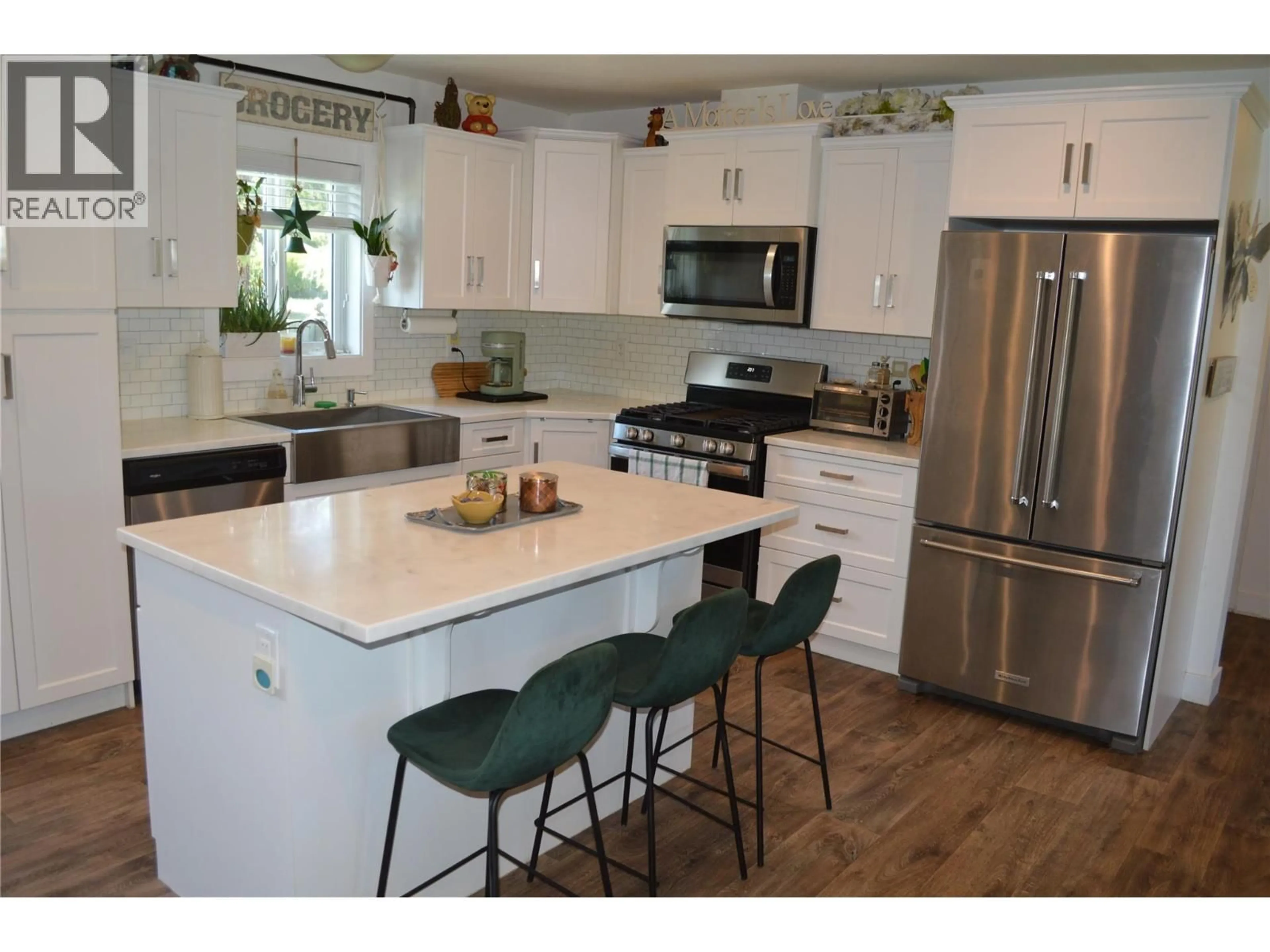 Open concept kitchen, wood/laminate floor for 8187 DONALDSON DRIVE, Grand Forks British Columbia V0H1H2
