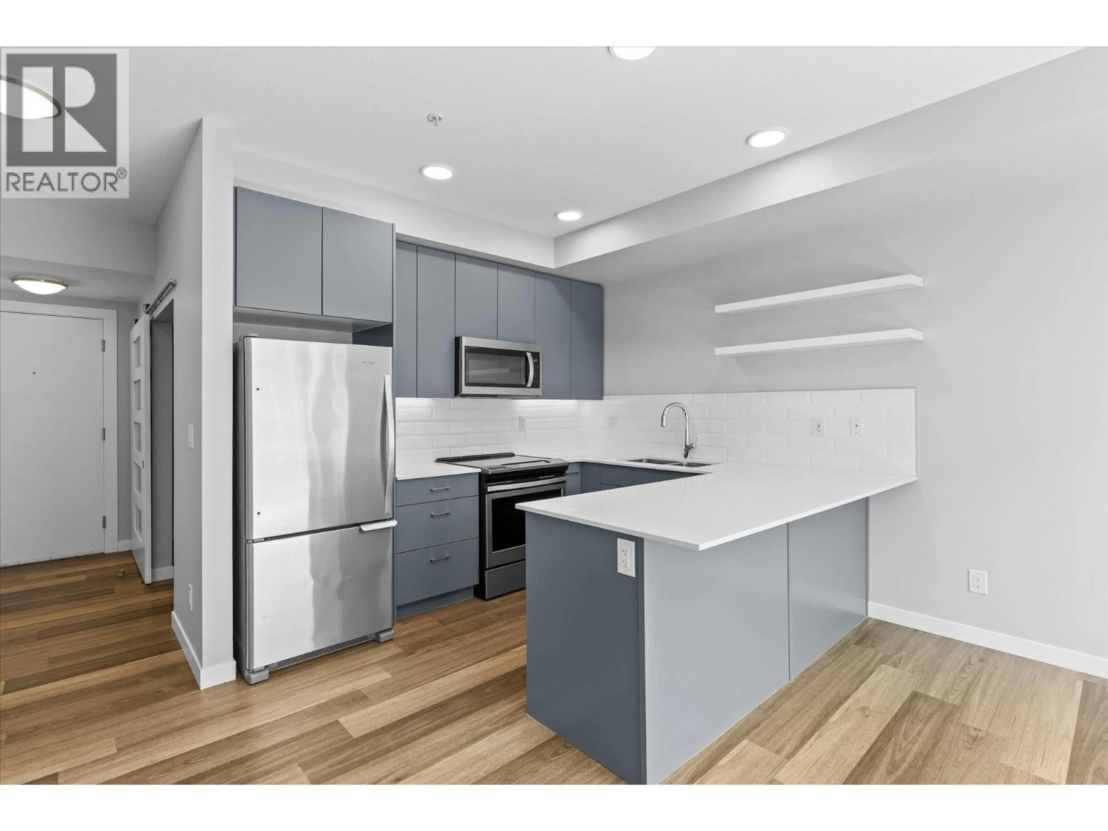 Standard kitchen, wood/laminate floor for 210 - 722 VALLEY ROAD, Kelowna British Columbia V1V0E2