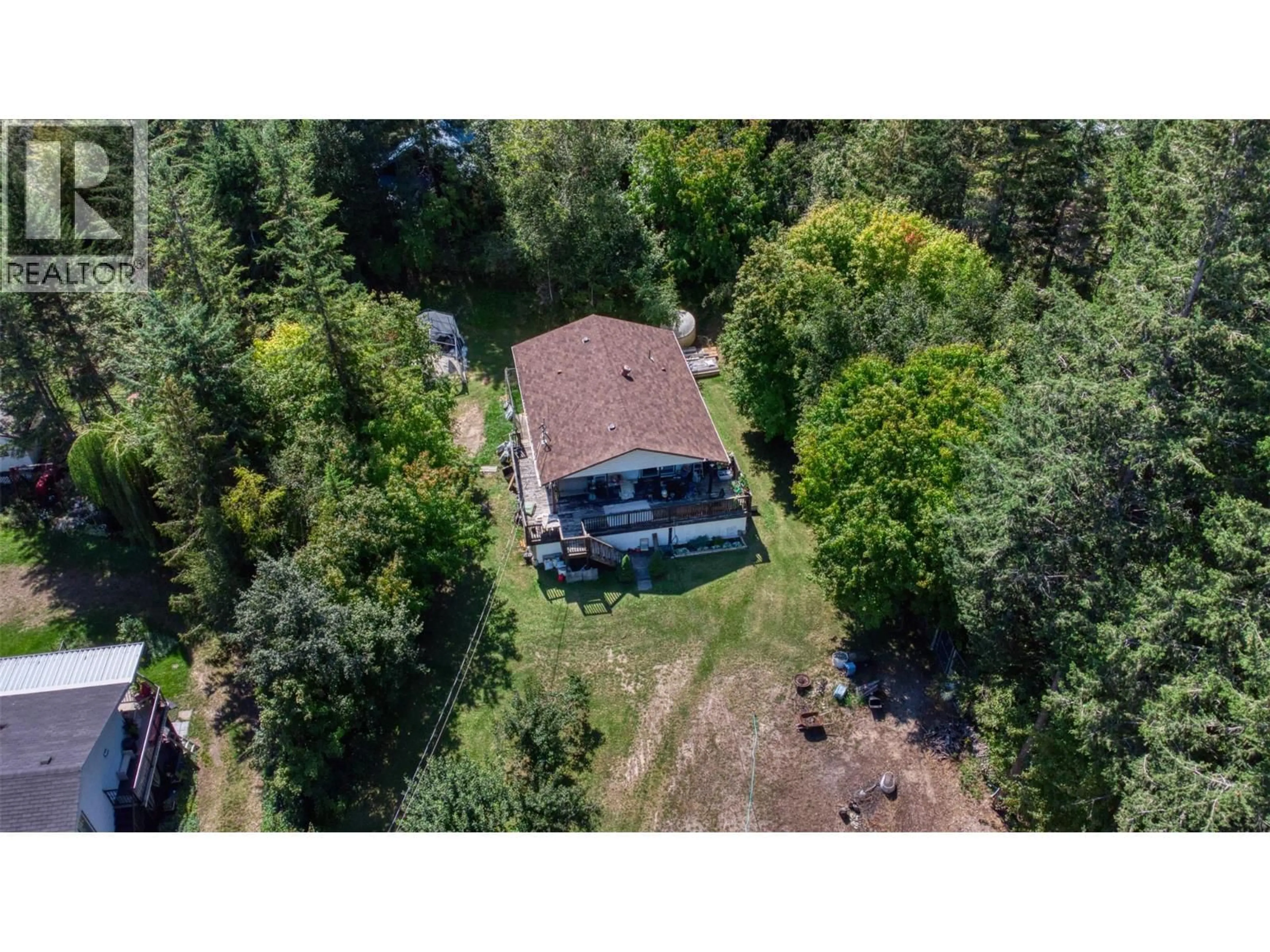 A pic from outside/outdoor area/front of a property/back of a property/a pic from drone, forest/trees view for 771 FIRWOOD ROAD, Kelowna British Columbia V1Z3V5