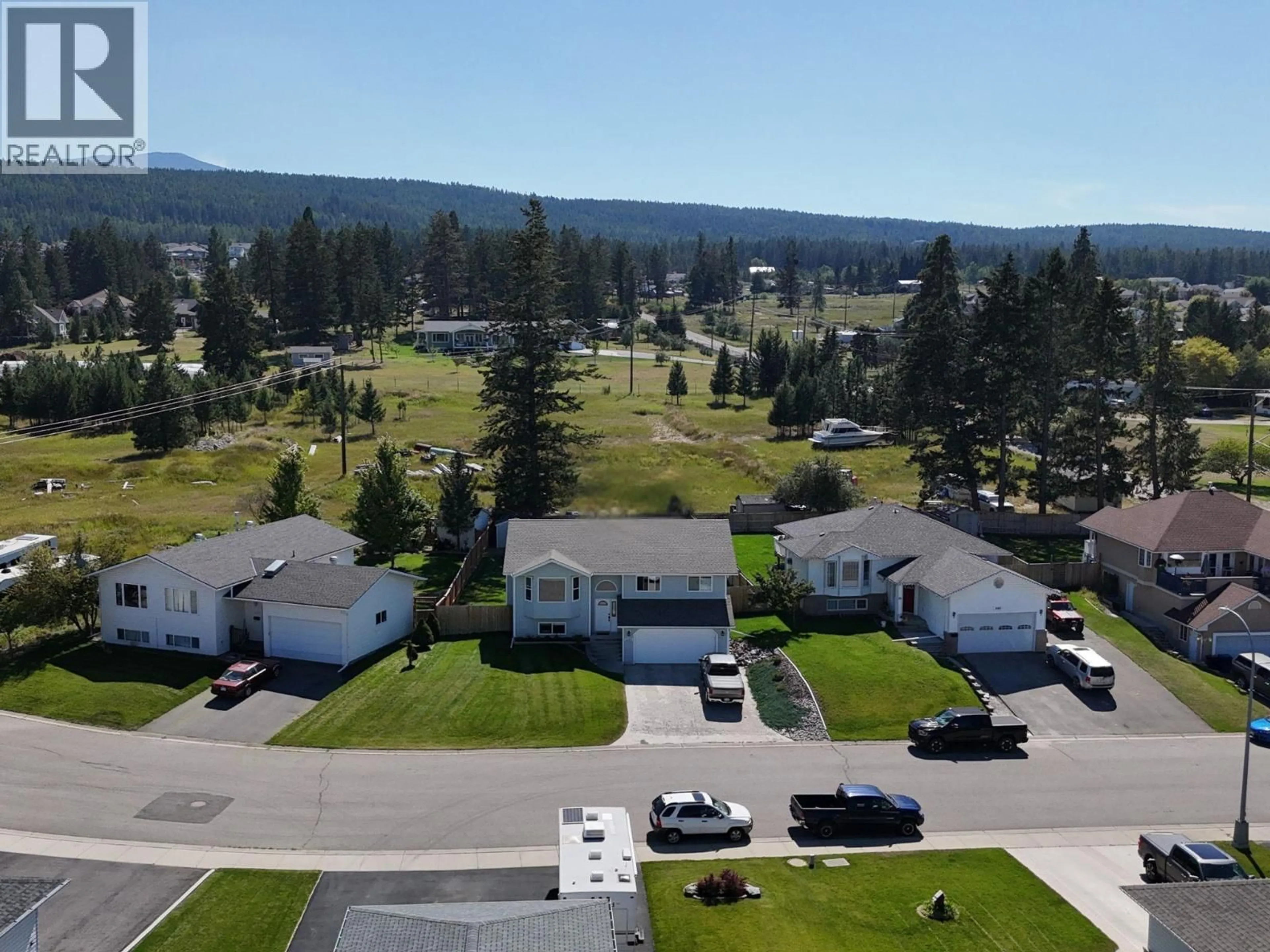 A pic from outside/outdoor area/front of a property/back of a property/a pic from drone, mountain view for 1209 13TH STREET SOUTH, Cranbrook British Columbia V1C6M6