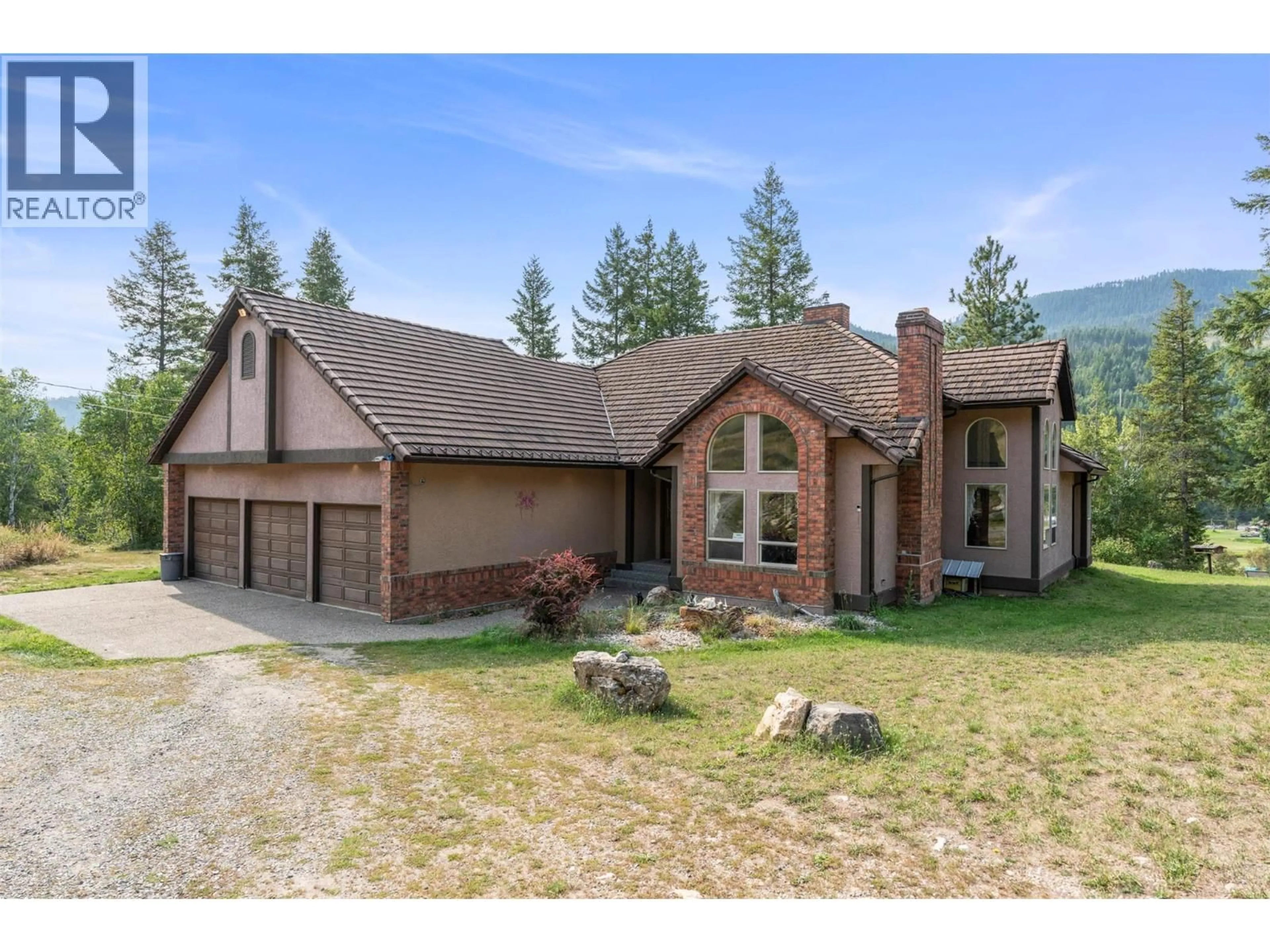 Home with brick exterior material, mountain view for 995 SHUSWAP RIVER DRIVE, Lumby British Columbia V0E2G6