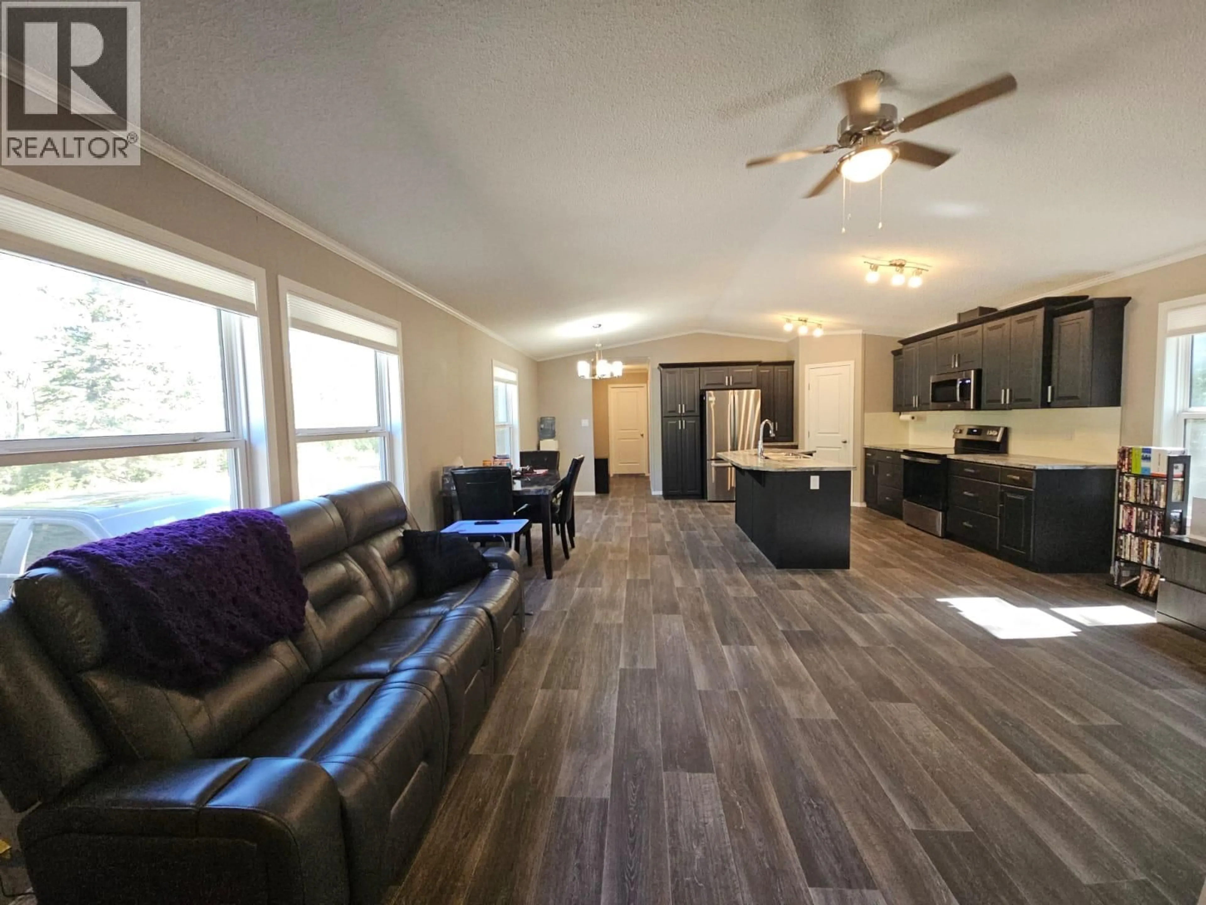 Living room with furniture, wood/laminate floor for 3593 WEST HAYWARD ROAD, Chetwynd British Columbia V0C1J0
