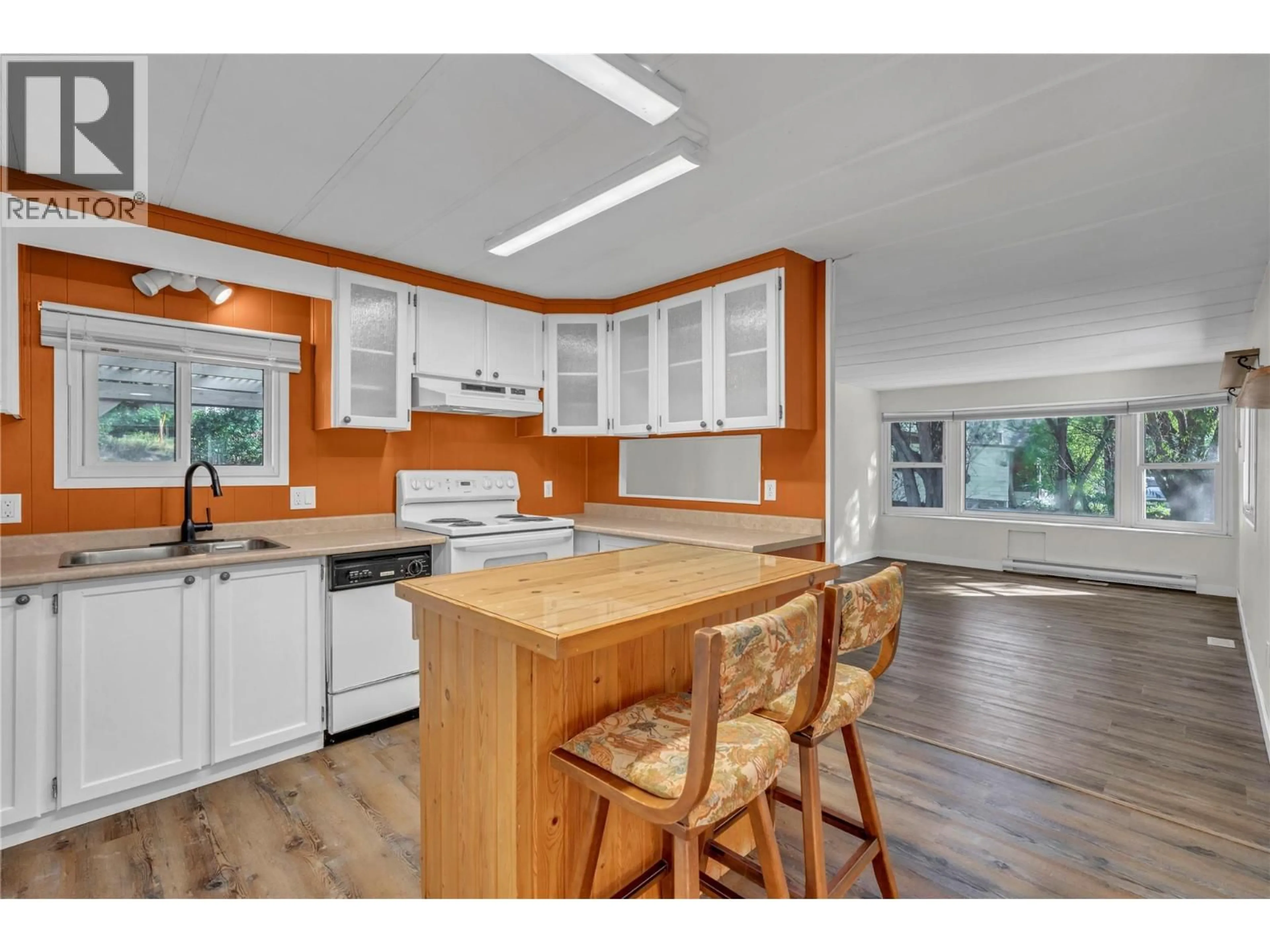 Open concept kitchen, wood/laminate floor for 140 FISH LAKE ROAD, Summerland British Columbia V0H1Z8