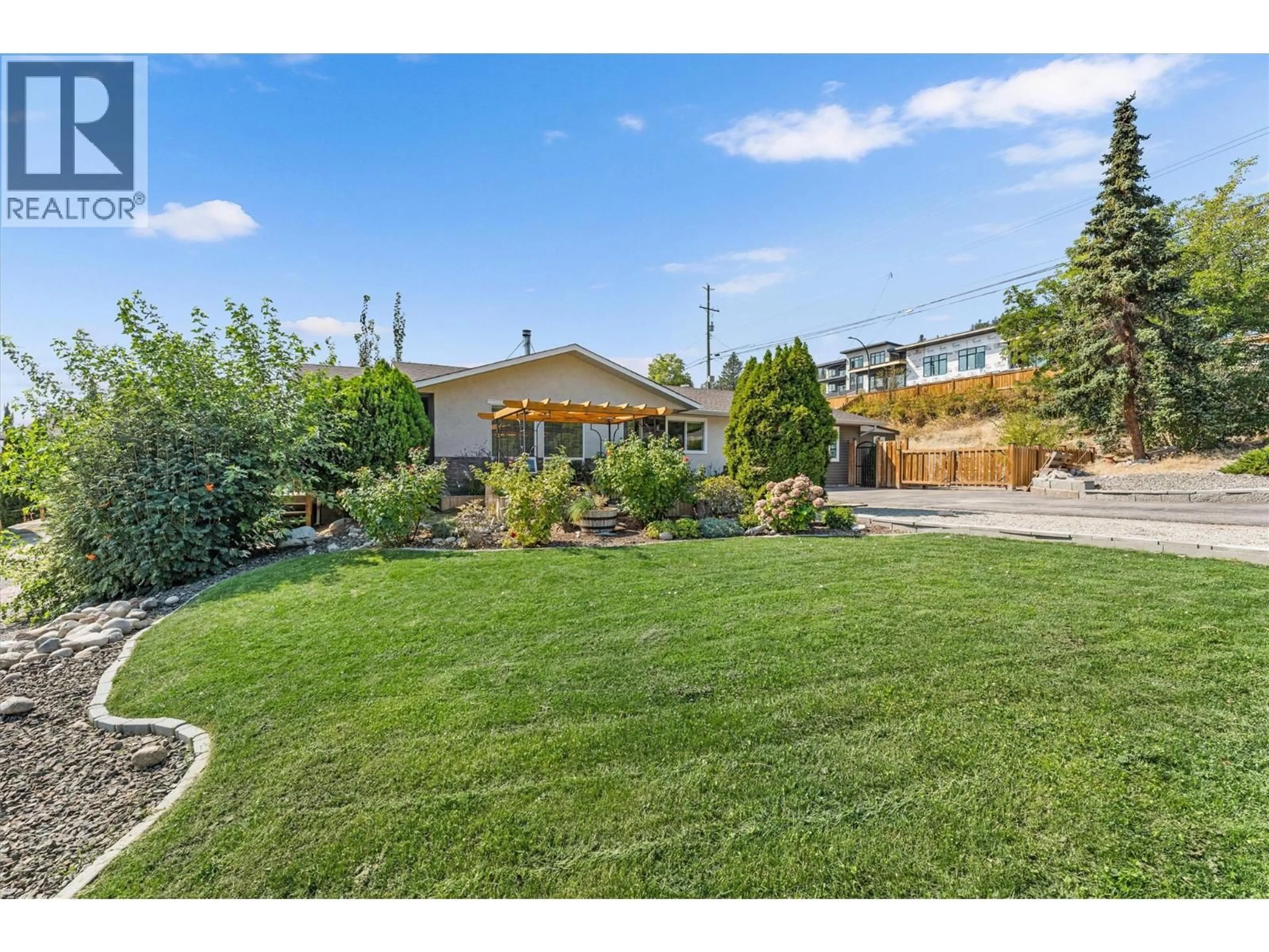 A pic from outside/outdoor area/front of a property/back of a property/a pic from drone, street for 3702 BEACH AVENUE, Peachland British Columbia V0H1X0