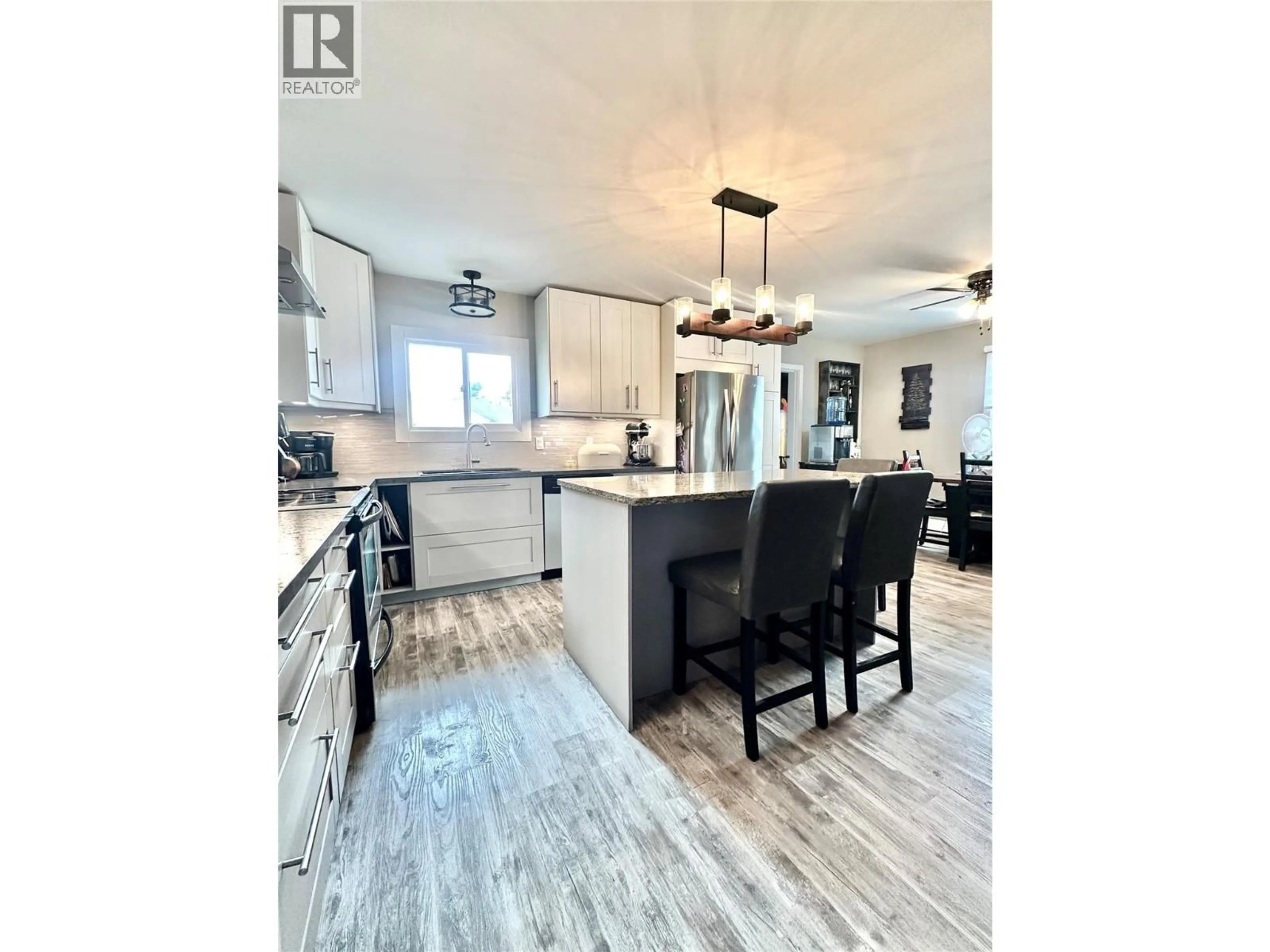 Open concept kitchen, wood/laminate floor for 310 6TH AVENUE, Keremeos British Columbia V0X1N3