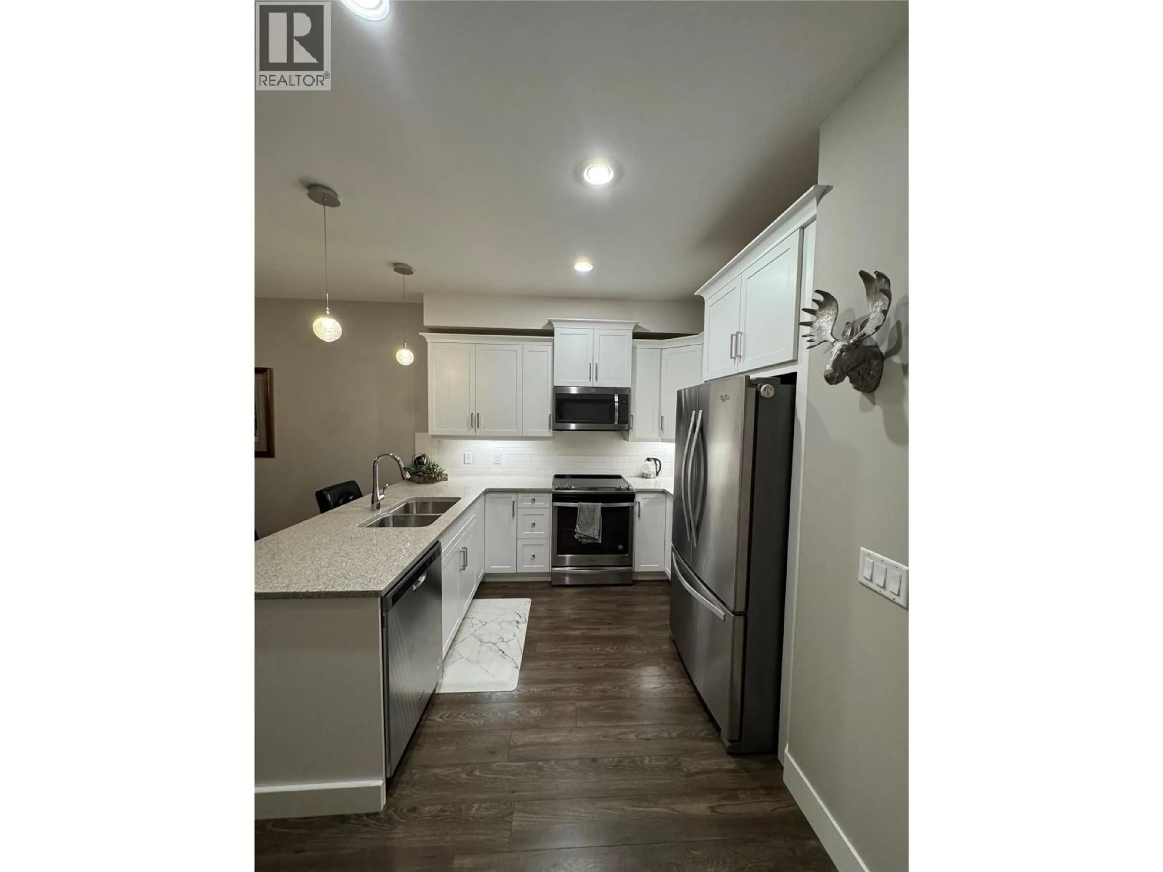Open concept kitchen, wood/laminate floor for 59 - 3359 COUGAR ROAD, West Kelowna British Columbia V4T3G1