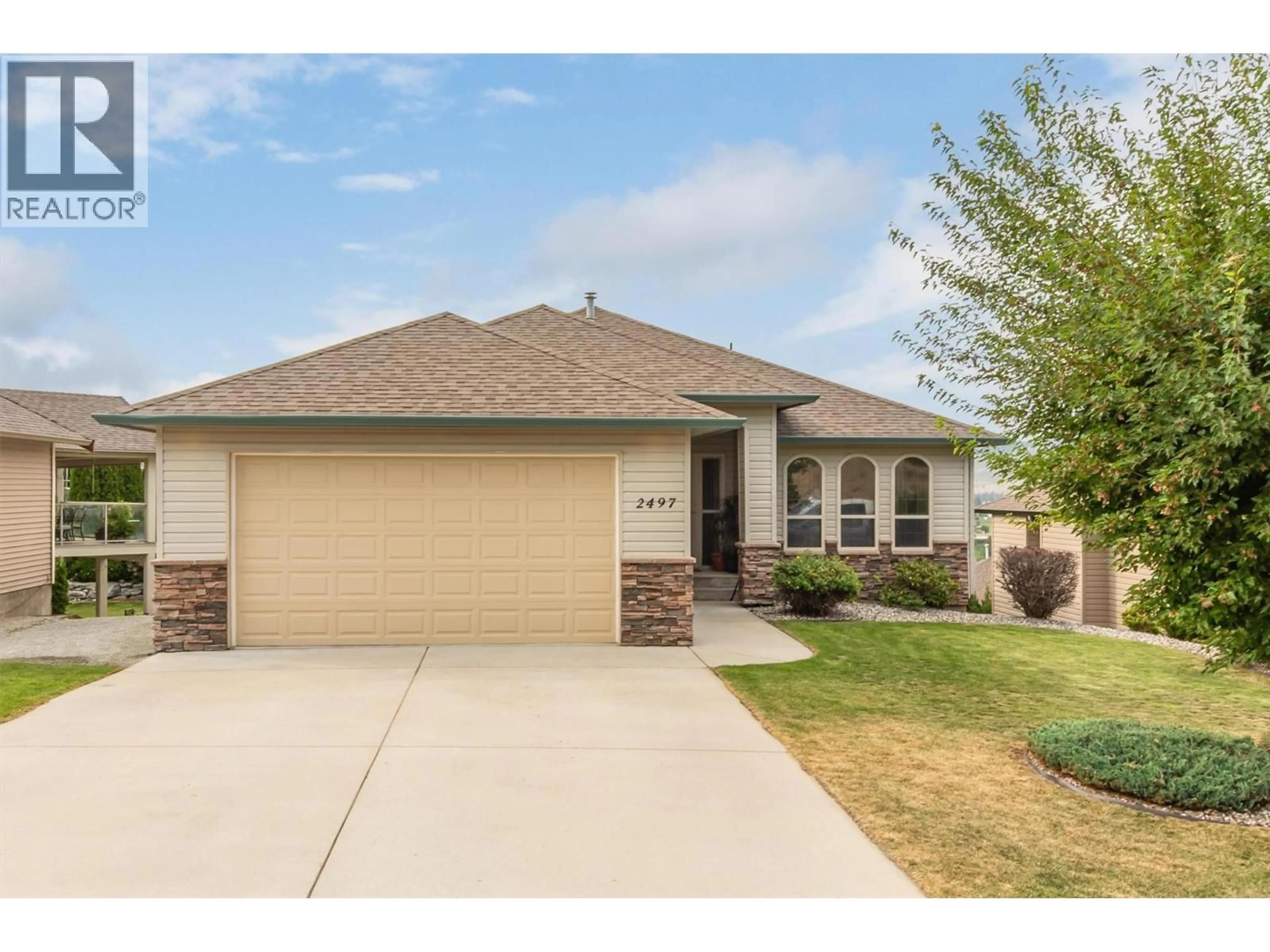 Home with vinyl exterior material, street for 2497 WILD HORSE DRIVE, West Kelowna British Columbia V4T2Y4