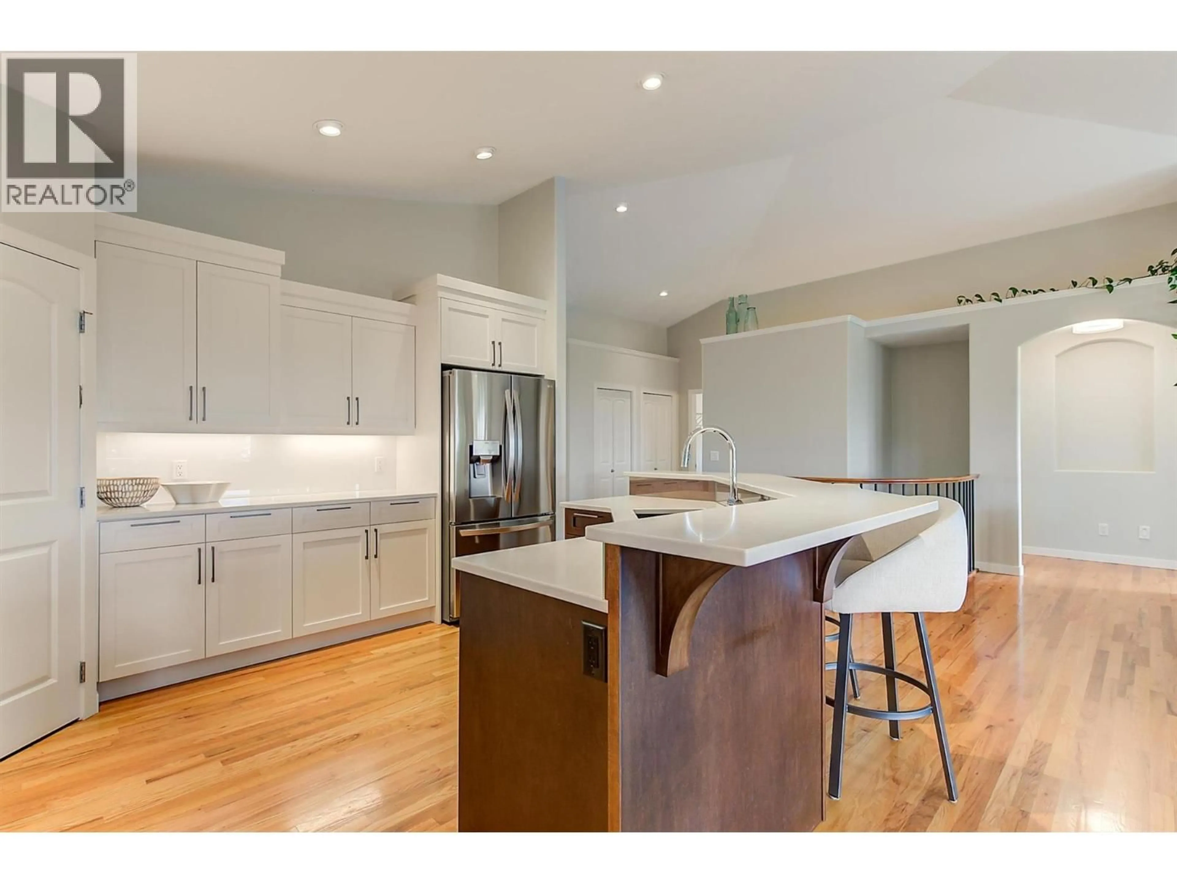 Open concept kitchen, wood/laminate floor for 2497 WILD HORSE DRIVE, West Kelowna British Columbia V4T2Y4