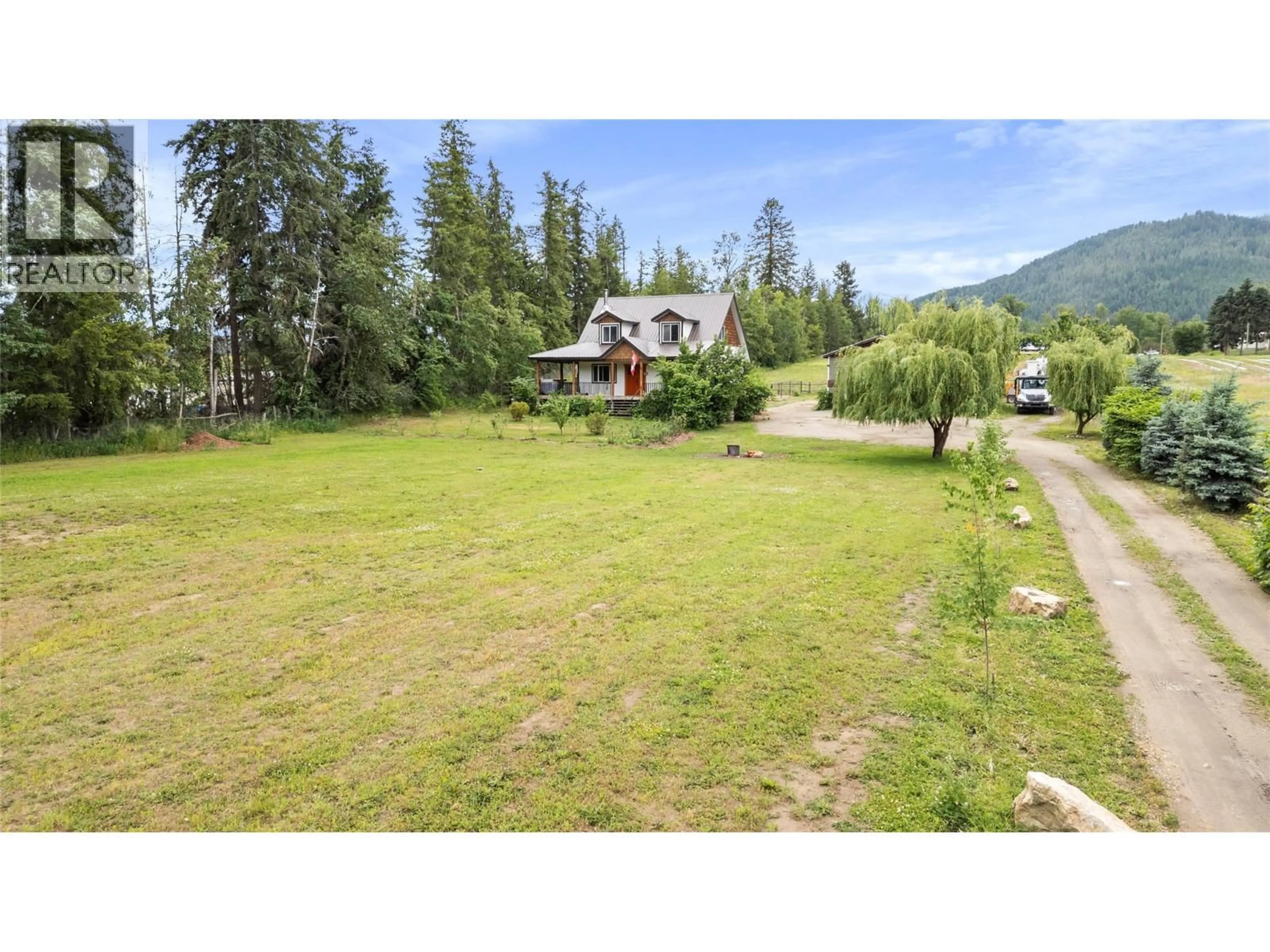A pic from outside/outdoor area/front of a property/back of a property/a pic from drone, mountain view for 4150 20 AVENUE SOUTHEAST, Salmon Arm British Columbia V1E1X9