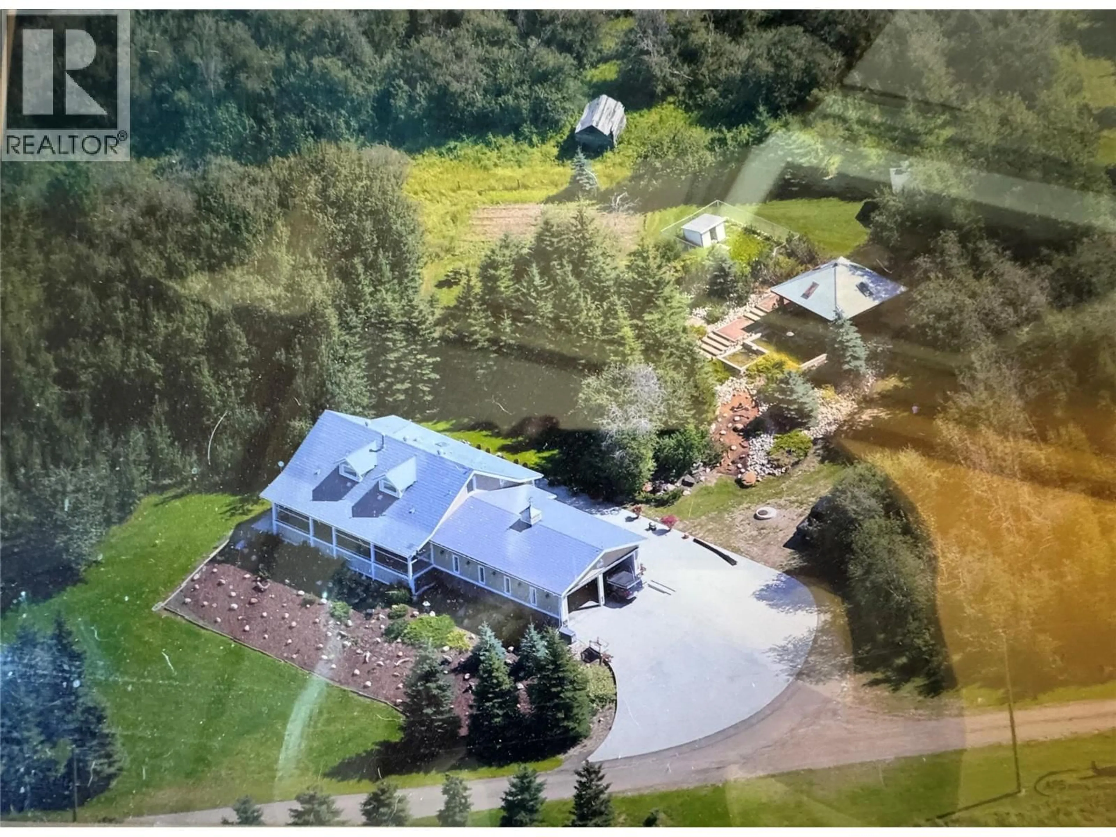 A pic from outside/outdoor area/front of a property/back of a property/a pic from drone, mountain view for 149 49 HIGHWAY, Dawson Creek British Columbia V1G4E6