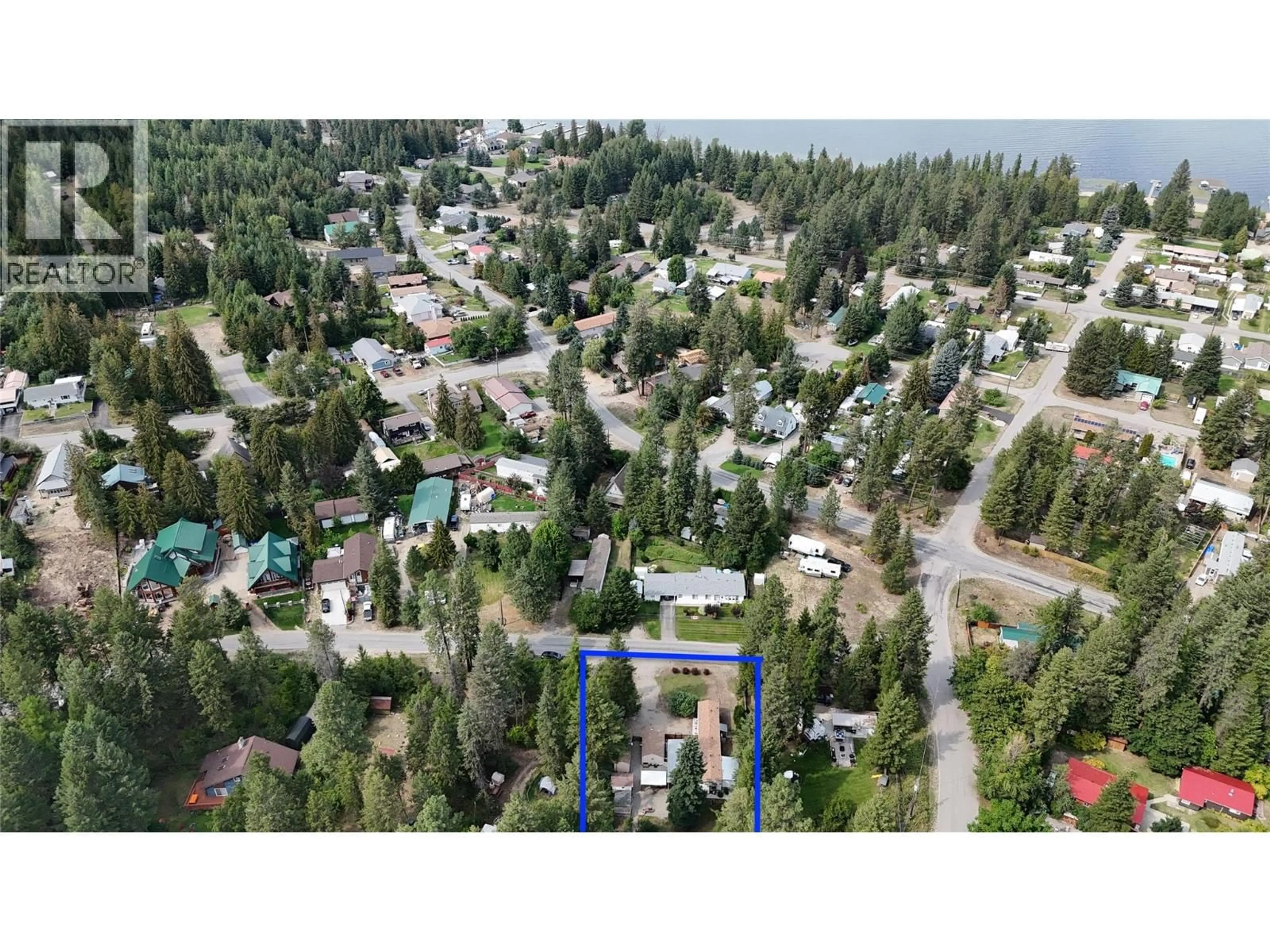 A pic from outside/outdoor area/front of a property/back of a property/a pic from drone, forest/trees view for 1558 THOMPSON ROAD, Christina Lake British Columbia V0H1E0