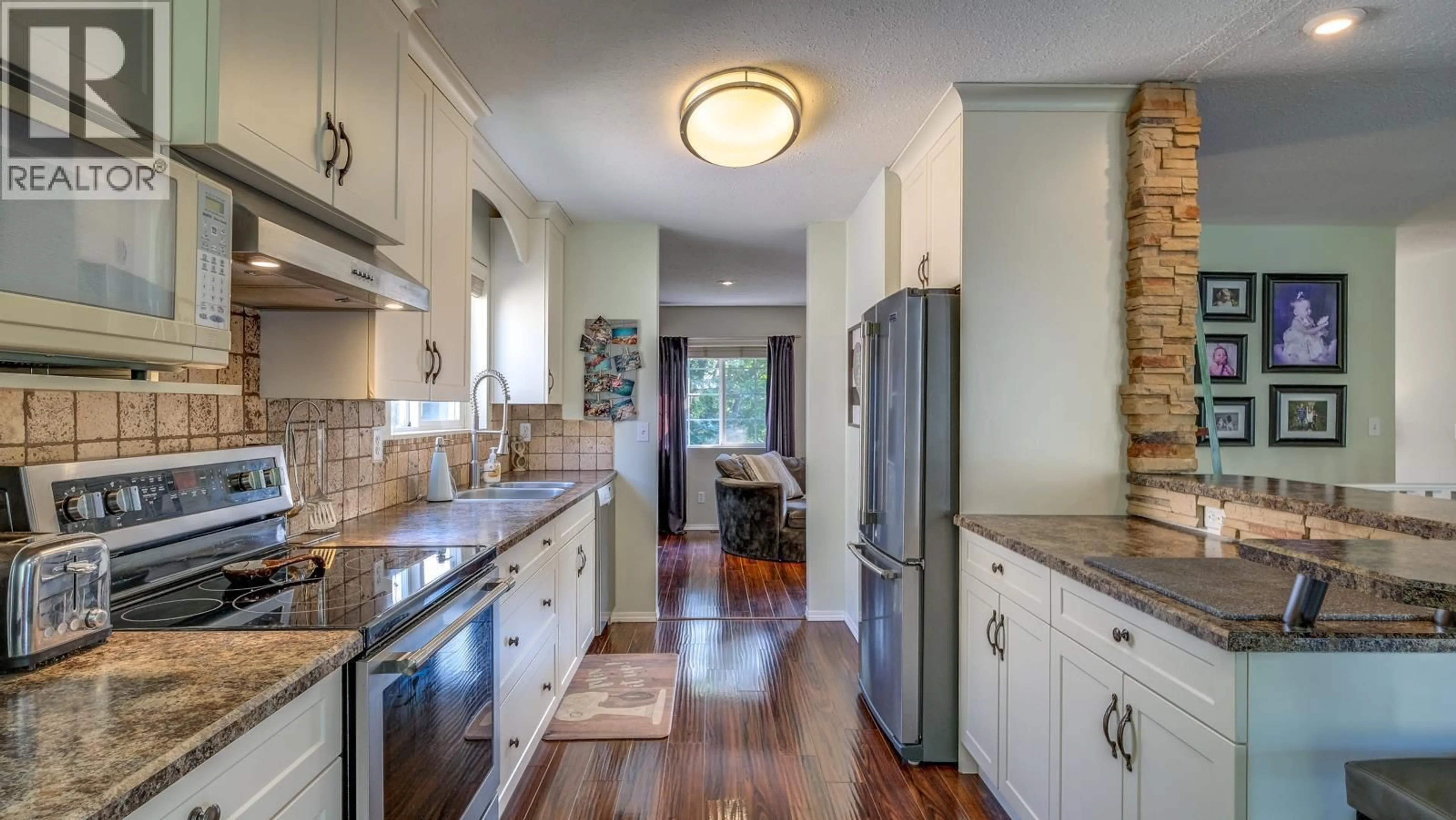 Open concept kitchen, ceramic/tile floor for 1853 GLENHAVEN CRESCENT, Kelowna British Columbia V1V1T4