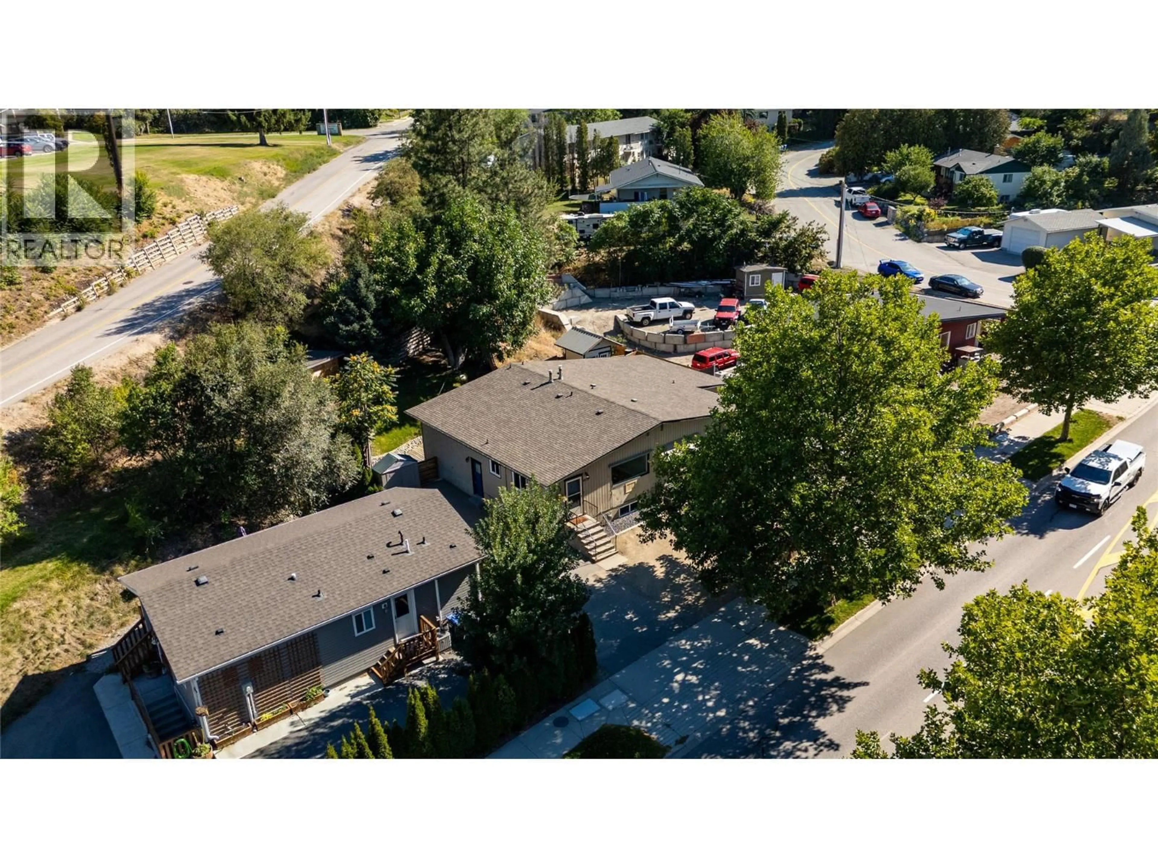 A pic from outside/outdoor area/front of a property/back of a property/a pic from drone, street for 8299 PRAIRIE VALLEY ROAD, Summerland British Columbia V0H1Z3