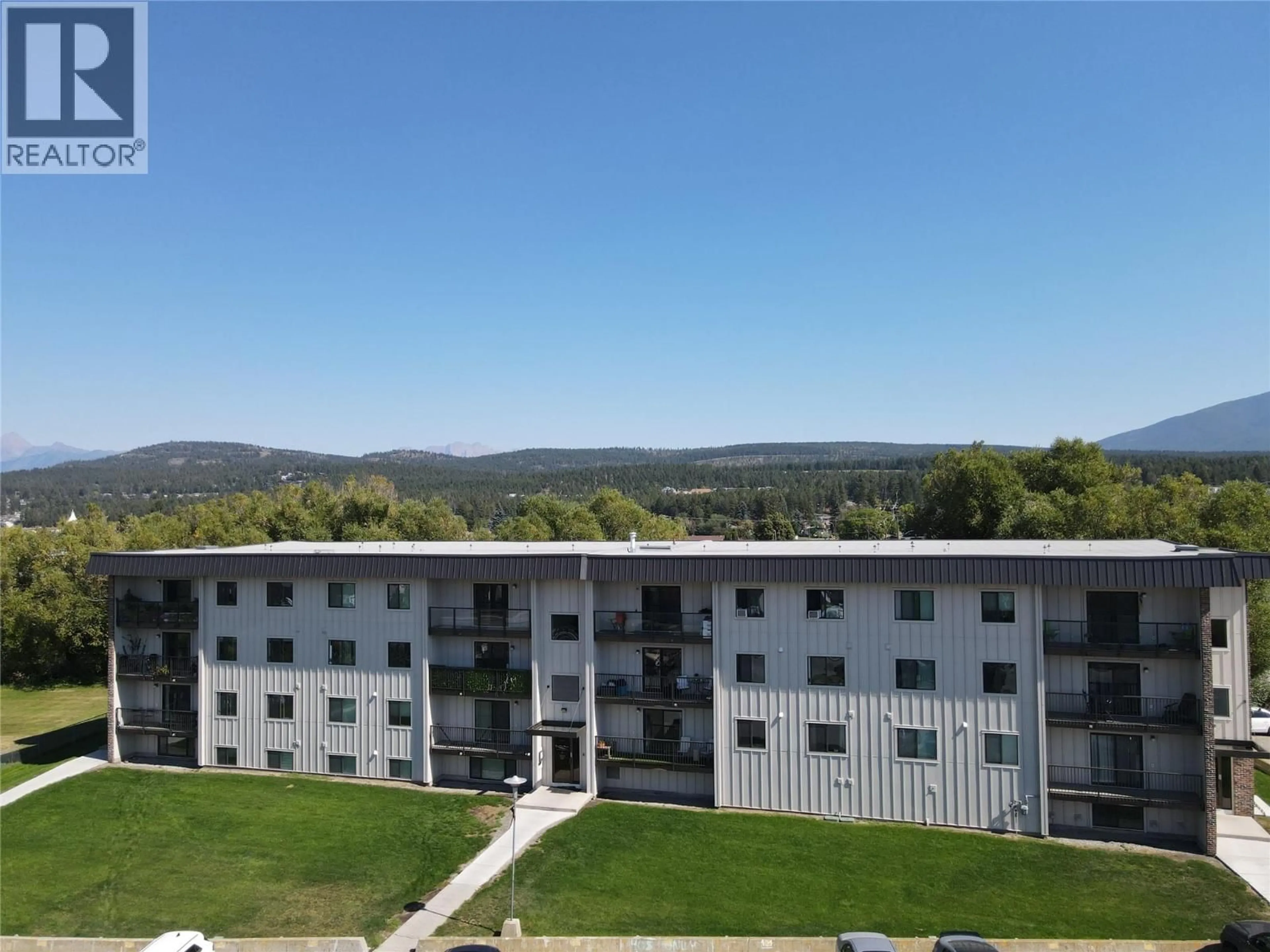 A pic from outside/outdoor area/front of a property/back of a property/a pic from drone, mountain view for 202 - 606 18TH AVENUE NORTH, Cranbrook British Columbia V1C5M1