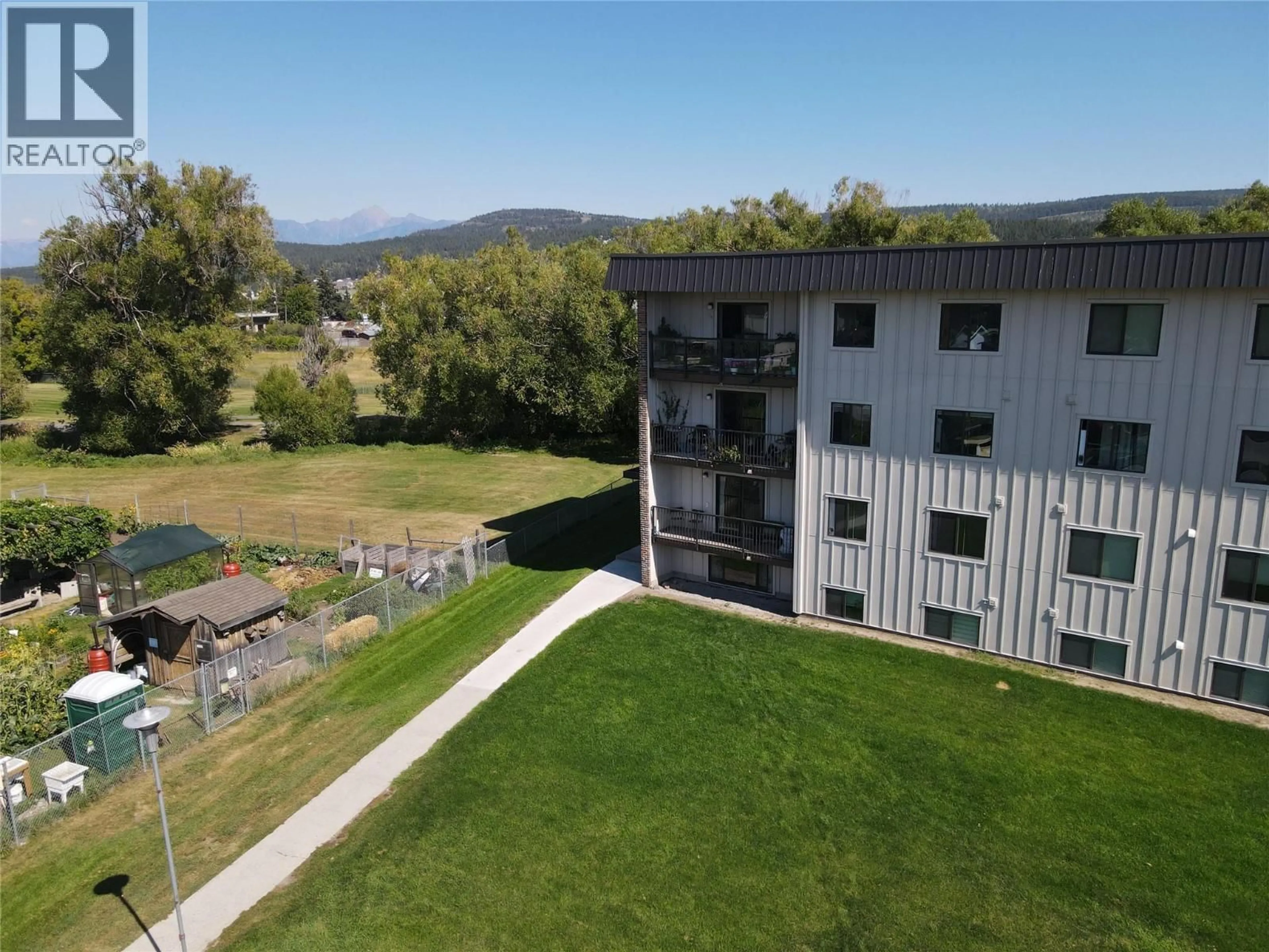A pic from outside/outdoor area/front of a property/back of a property/a pic from drone, mountain view for 202 - 606 18TH AVENUE NORTH, Cranbrook British Columbia V1C5M1