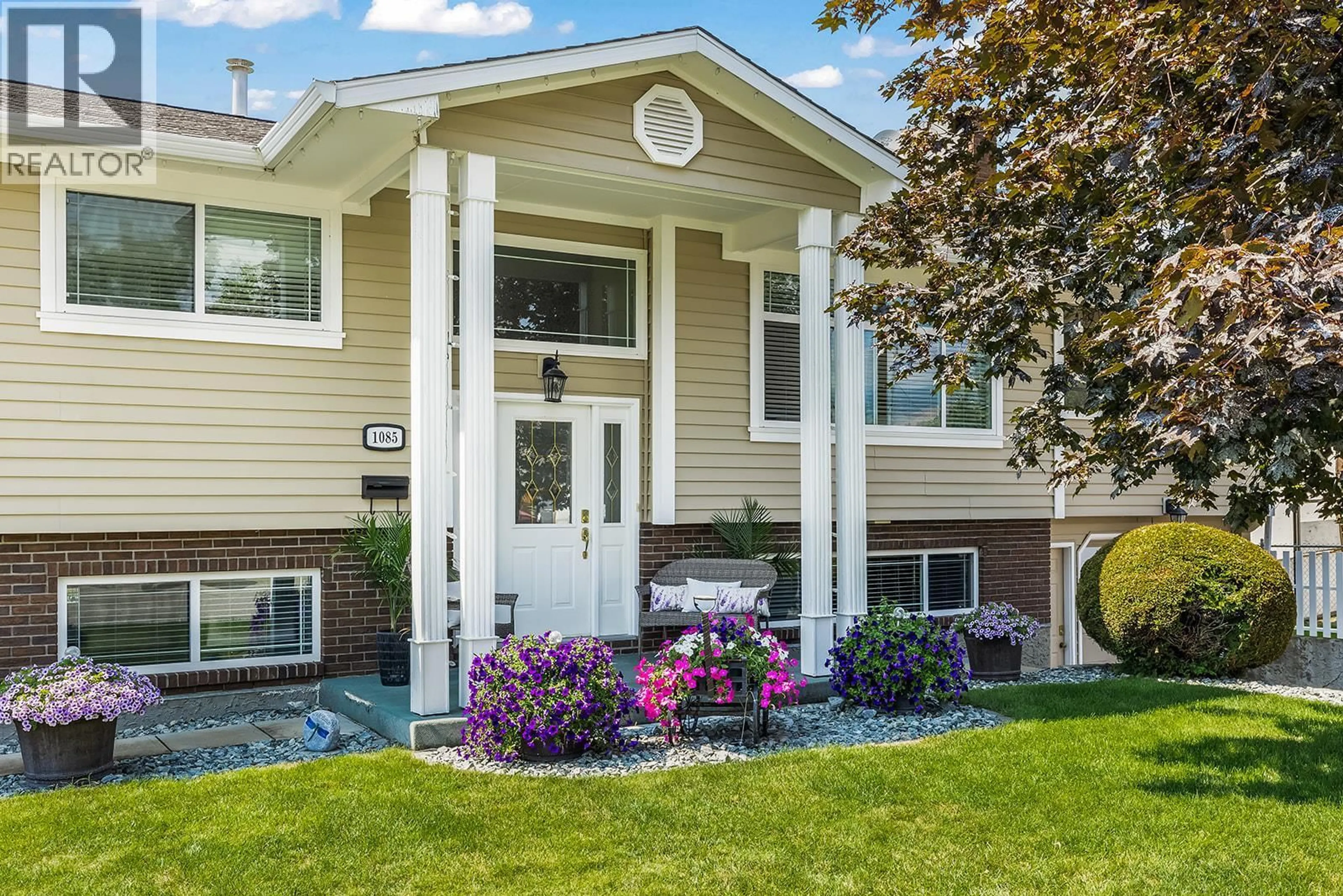 Home with vinyl exterior material, street for 1085 TAMARACK DRIVE, Kelowna British Columbia V1X1E3