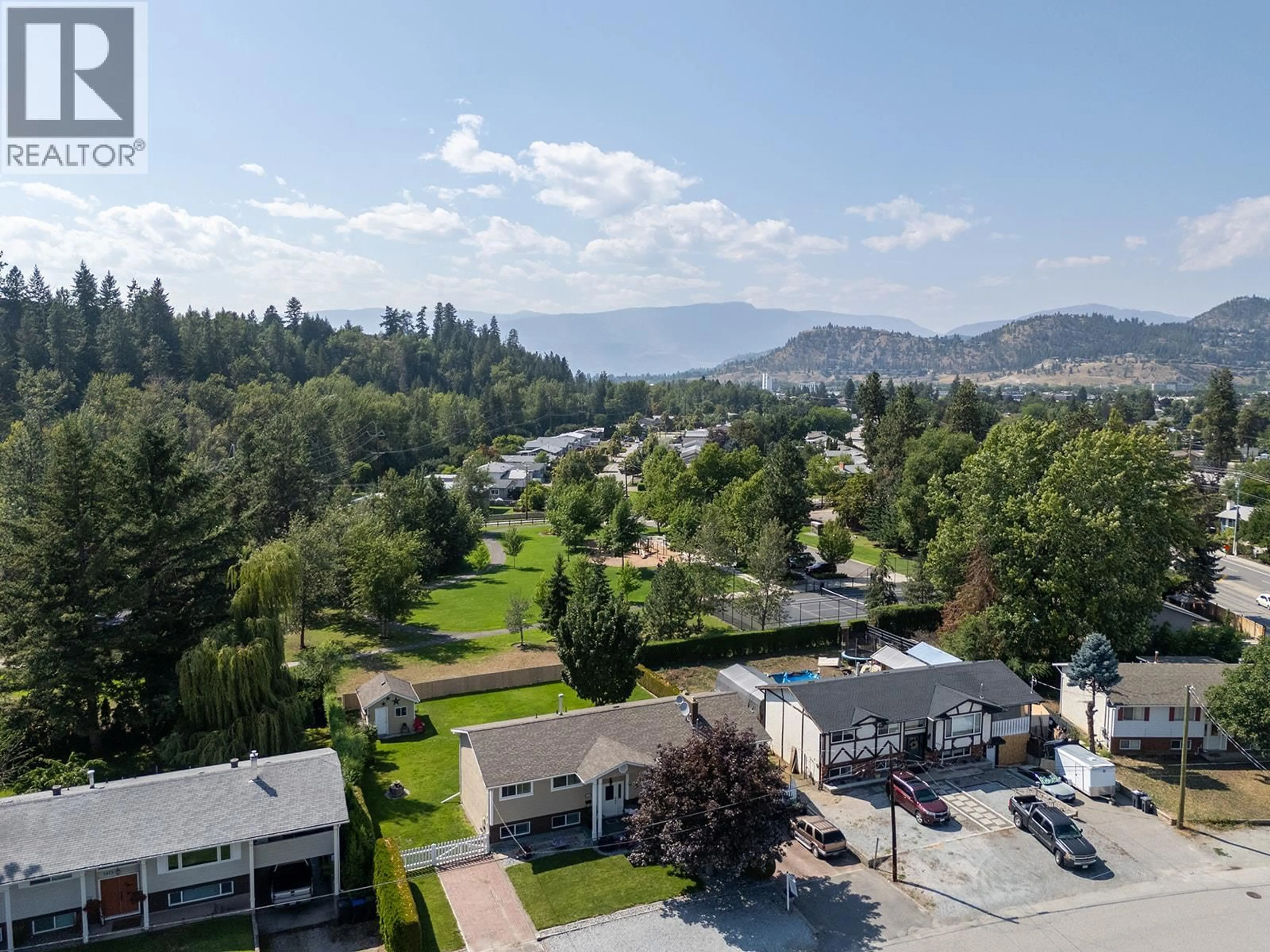 A pic from outside/outdoor area/front of a property/back of a property/a pic from drone, mountain view for 1085 TAMARACK DRIVE, Kelowna British Columbia V1X1E3