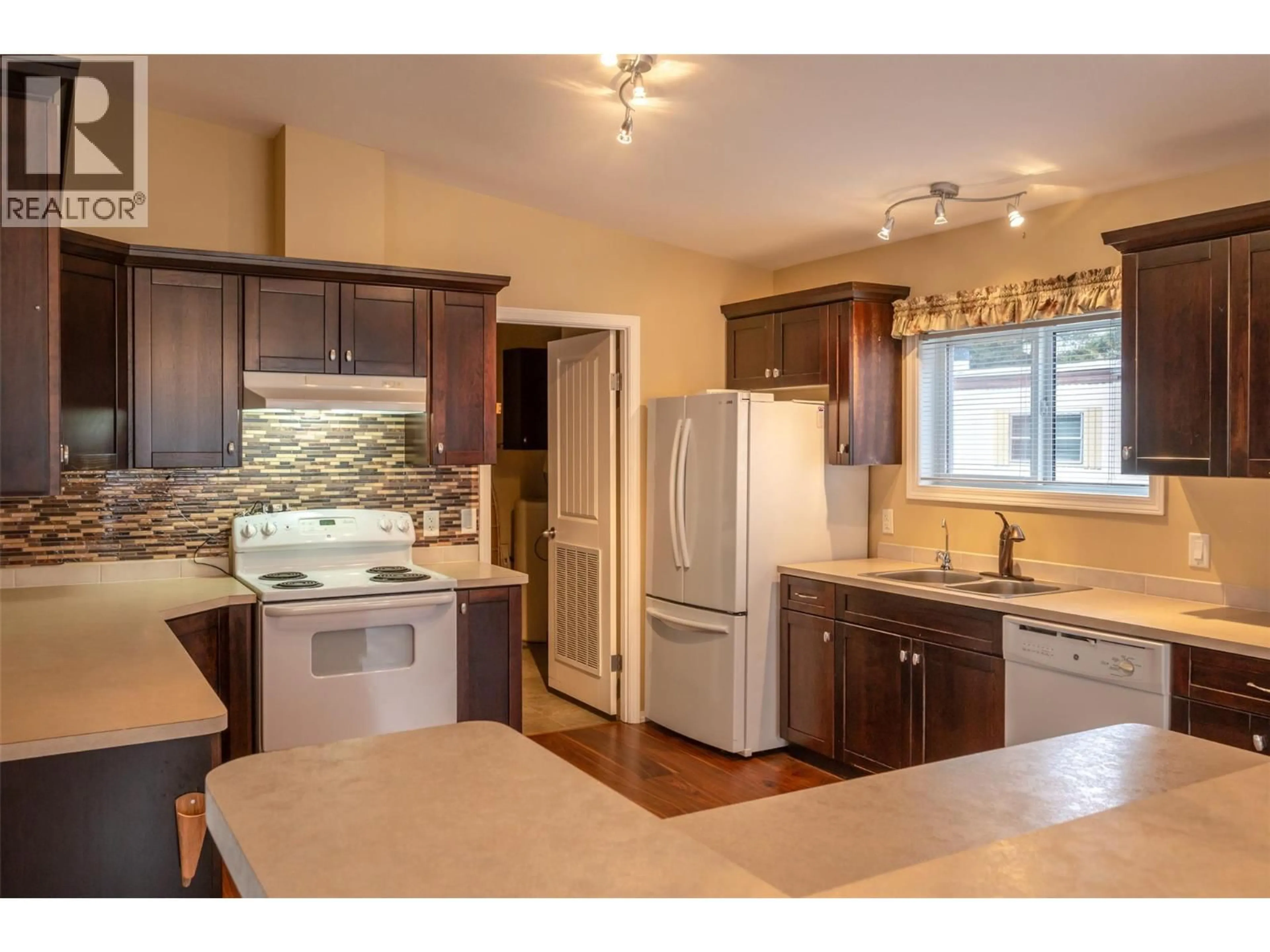 Open concept kitchen, wood/laminate floor for 7 - 1302 CEDAR STREET, Okanagan Falls British Columbia V0H1R0