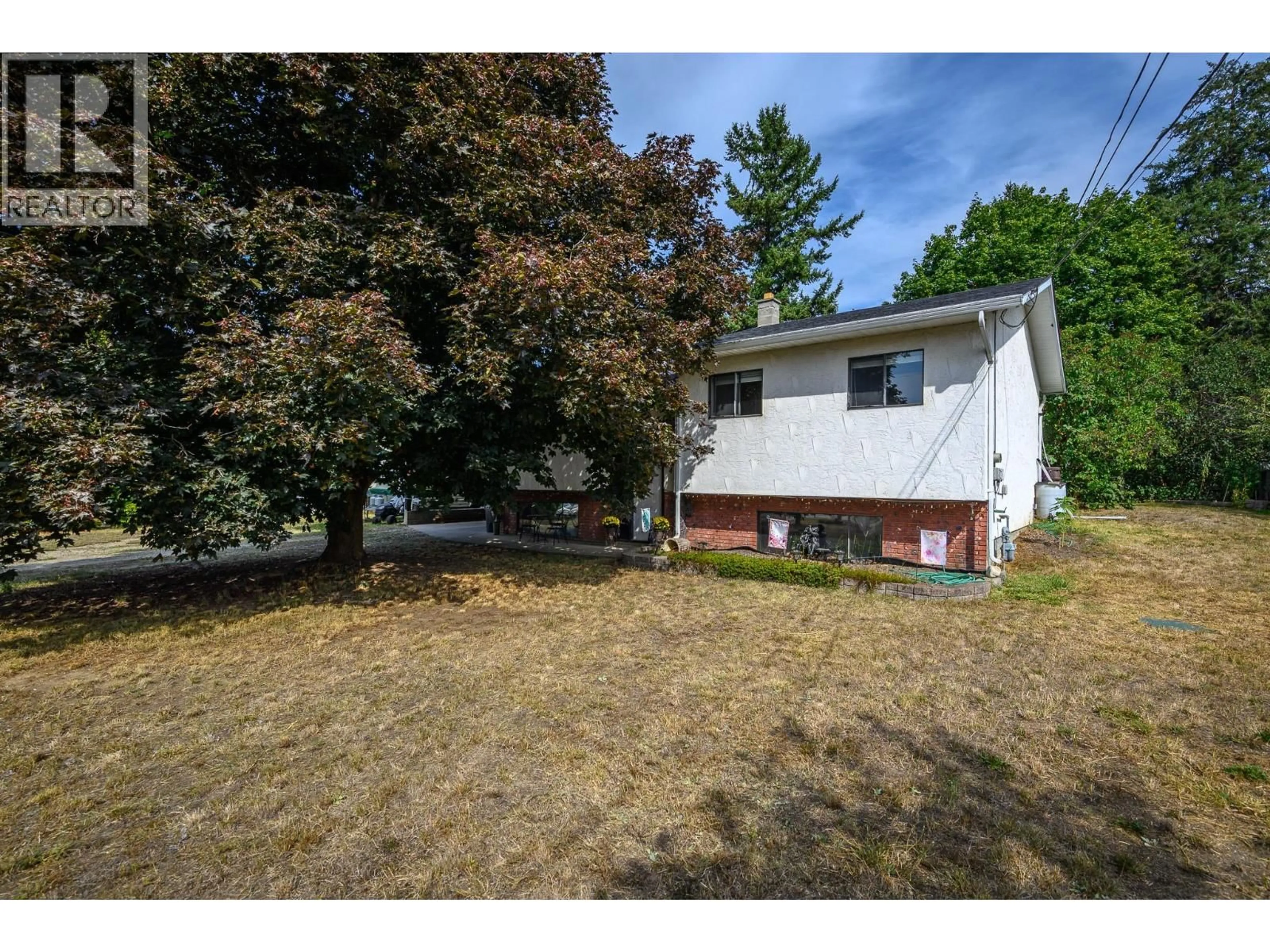 A pic from outside/outdoor area/front of a property/back of a property/a pic from drone, street for 3478 LOCKHART CRESCENT, Spallumcheen British Columbia V4Y0S9