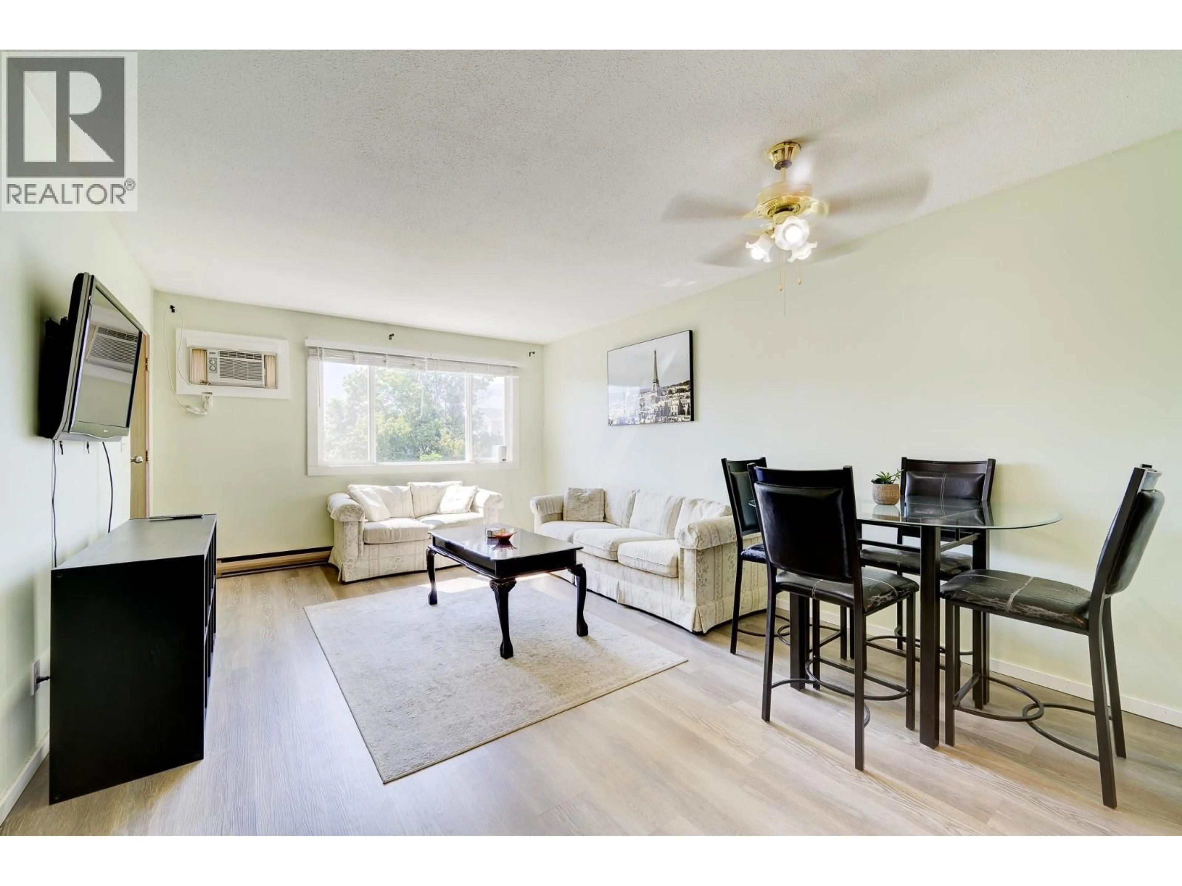 Living room with furniture, wood/laminate floor for 423 - 815 SOUTHILL STREET, Kamloops British Columbia V2B5L9