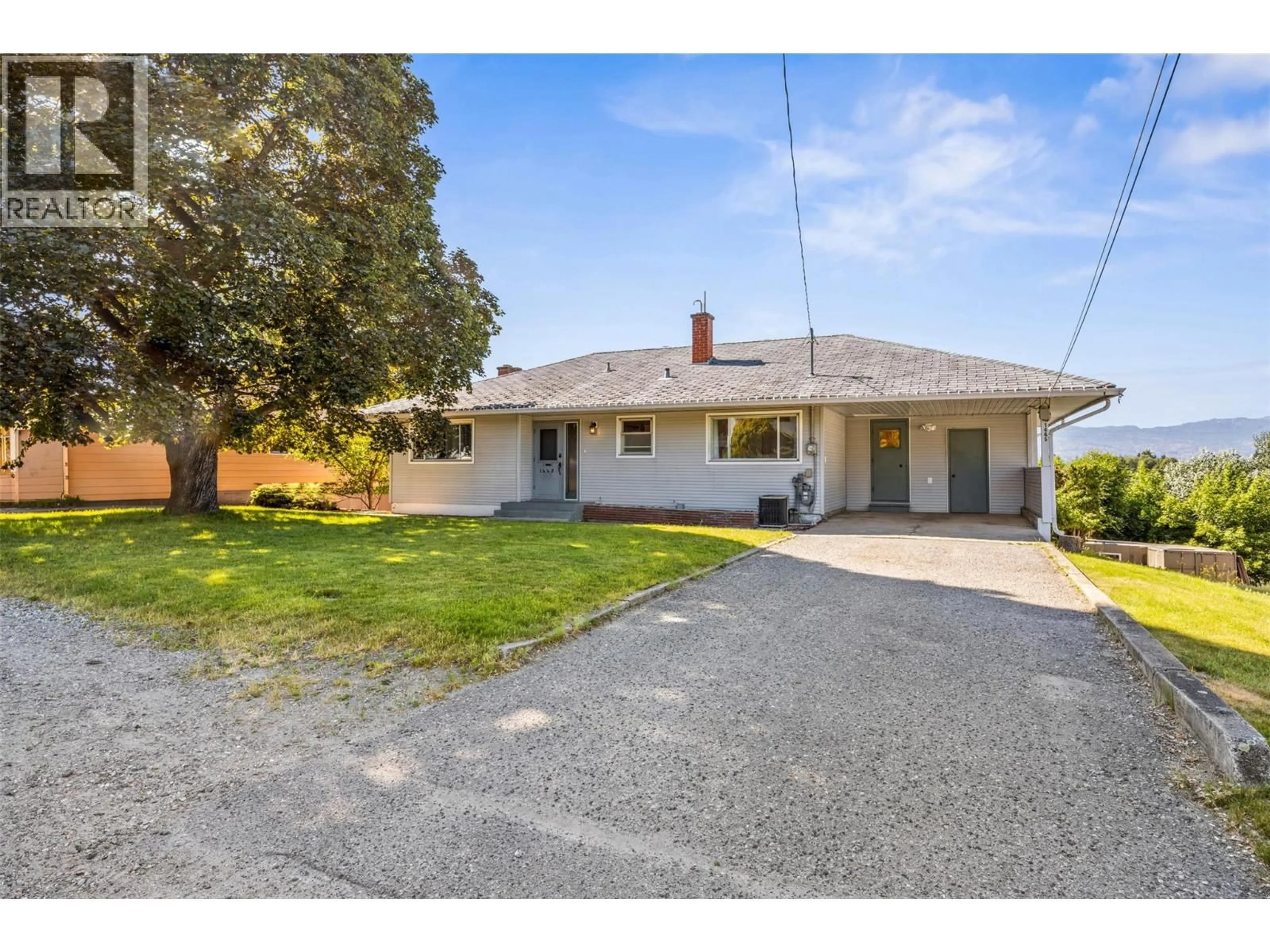 A pic from outside/outdoor area/front of a property/back of a property/a pic from drone, street for 1445 GLENVIEW AVENUE, Kelowna British Columbia V1Y3P5
