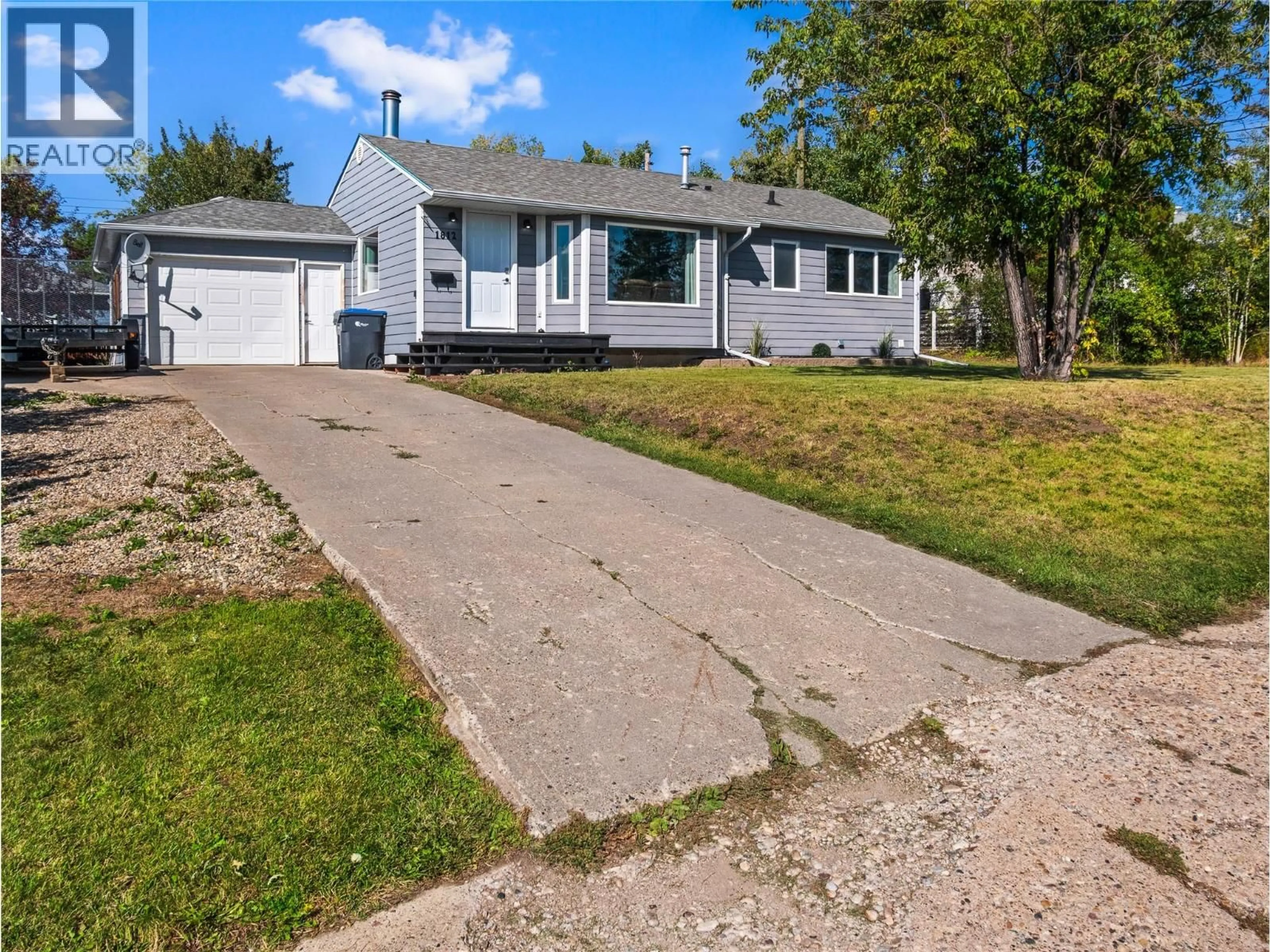 A pic from outside/outdoor area/front of a property/back of a property/a pic from drone, street for 1812 91 AVENUE, Dawson Creek British Columbia V1G1B1